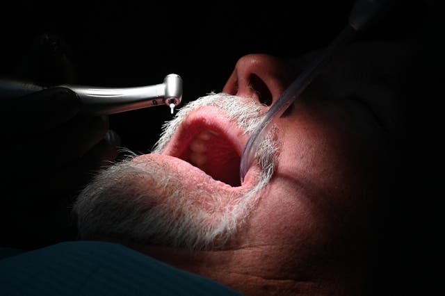 <p>A dentist at work at the Rubio Dental Group in Los Algodones, Mexico</p>