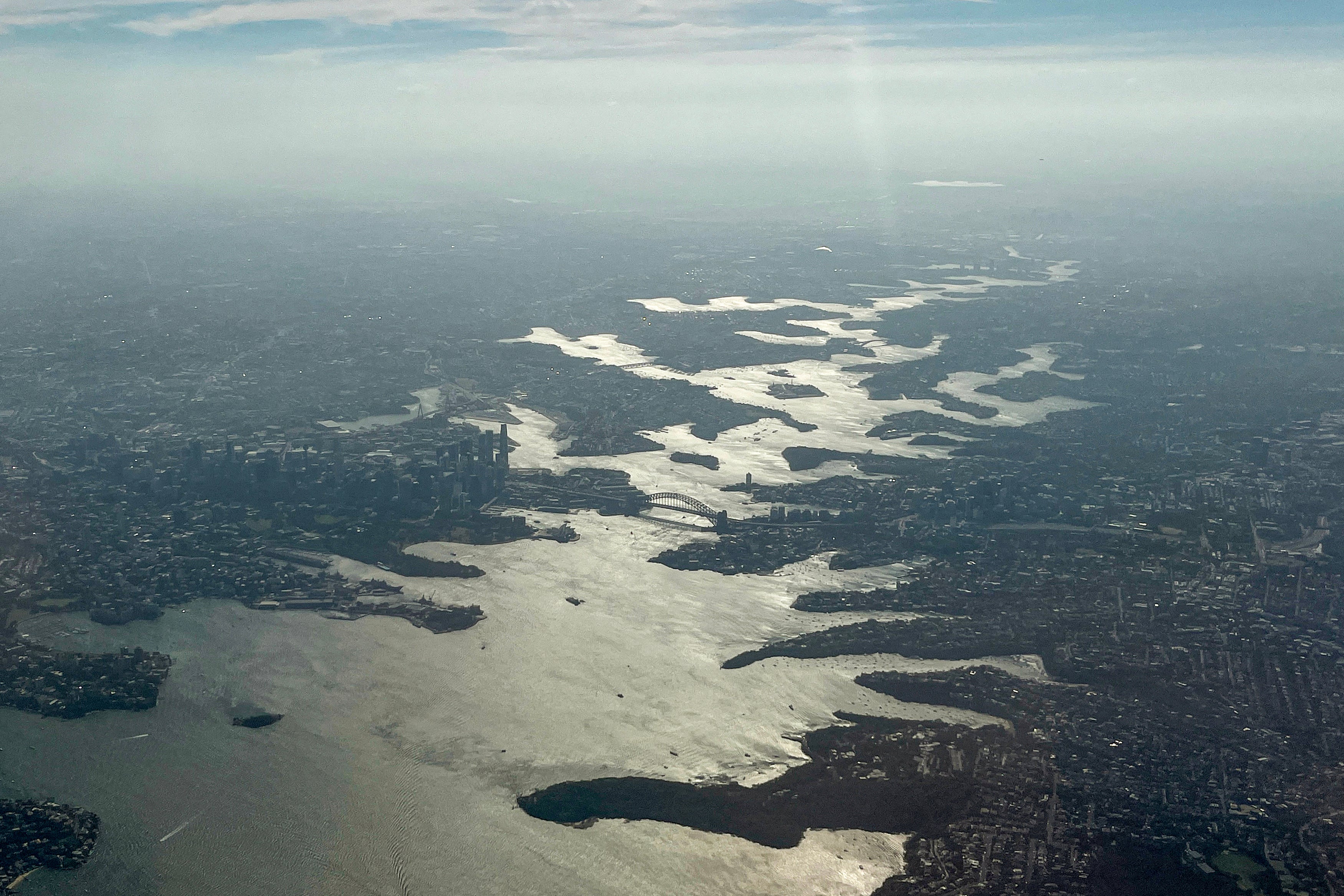 <p>File. Smoke rises from bushfires on the outskirts of Sydney on 8 December 2025</p>