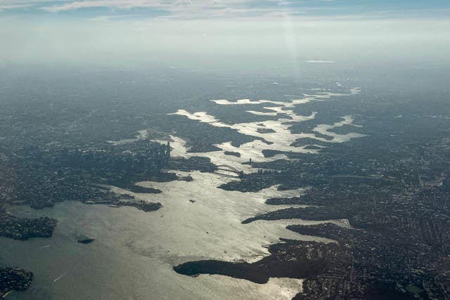 <p>File. This photo shows an aerial view of smoke from bushfires burning on the outskirts of Sydney on 8 December 2025</p>