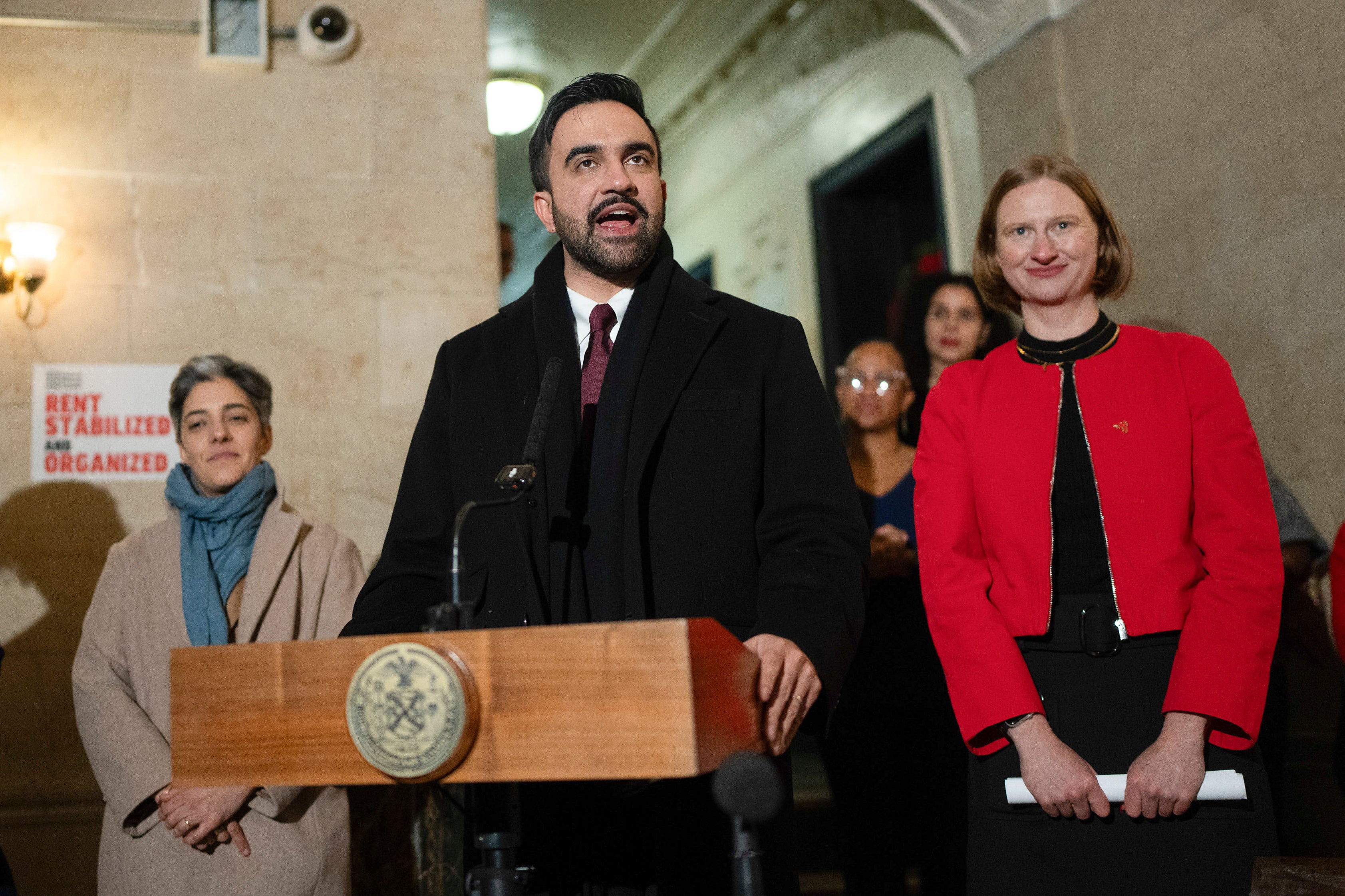 New York Mayor Zohran Mamdani, center, speaks during a news conference with Cea Weaver, right, Thursday, Jan. 1, 2026, in New York