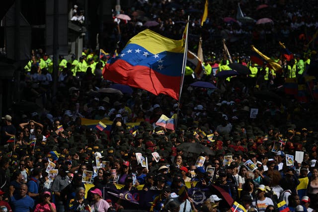 <p>People attend a rally in support of ousted Venezuela's President Nicolas Maduro and his wife Cilia Flores in Caracas on January 6, 2026</p>