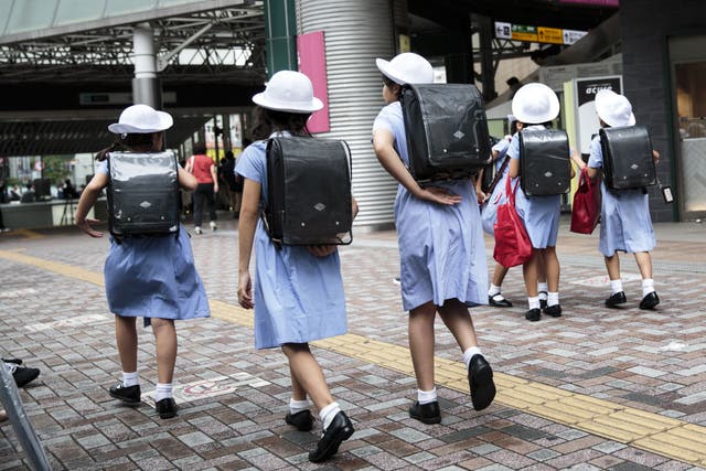 <p>File  Schoolgirls walk home at Ebisu district in Tokyo on September 4, 2017.</p>