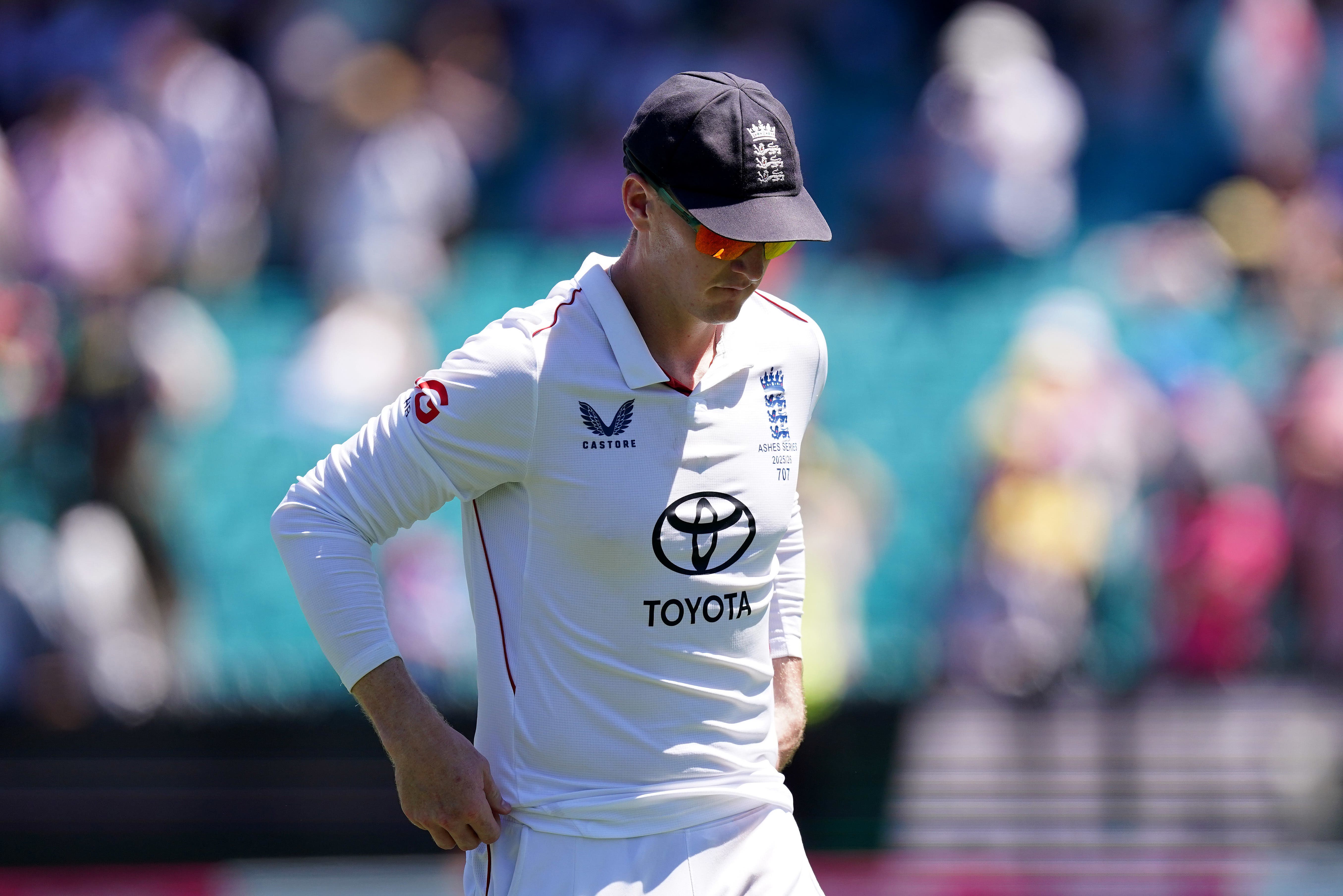 <p>England’s Harry Brook looks dejected on day five of the fifth Ashes Test against Australia in Sydney (Robbie Stephenson/PA).</p>