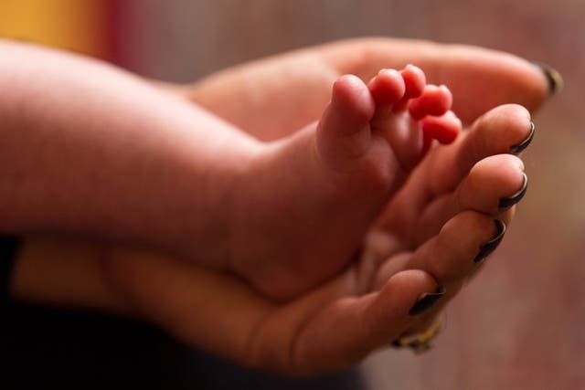 Two-fifths of parents said they have cut back on non-essential spending since having a child, the Current Account Switch Service said (Dominic Lipinski/PA)