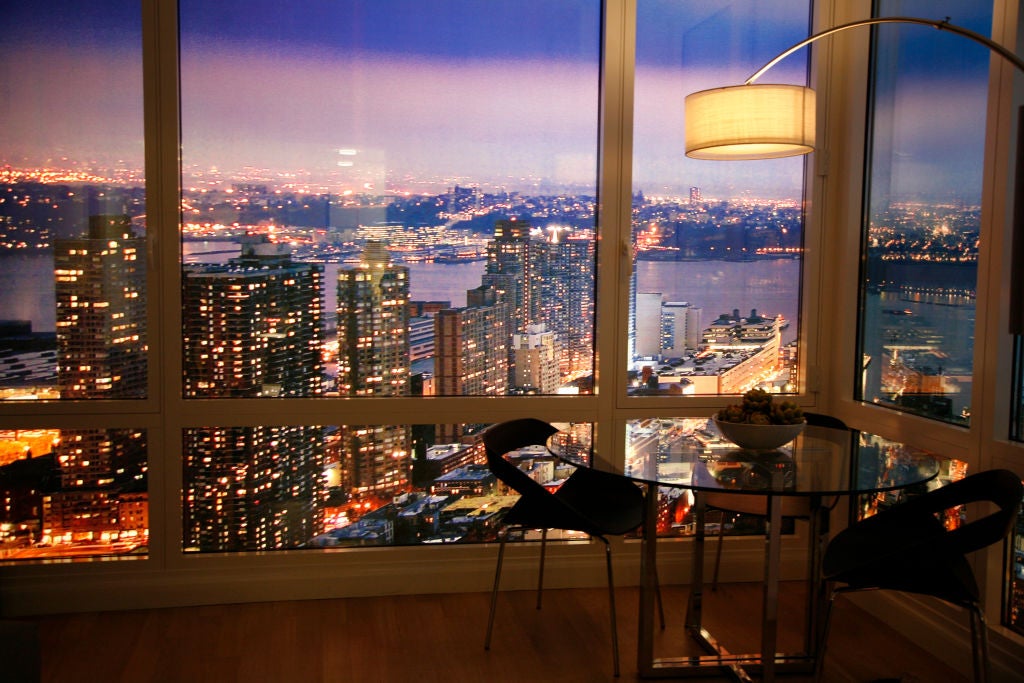 <p>A New York City apartment overlooking the skyline. In some cities, the entry-level price of a luxury home is three times the national average</p>