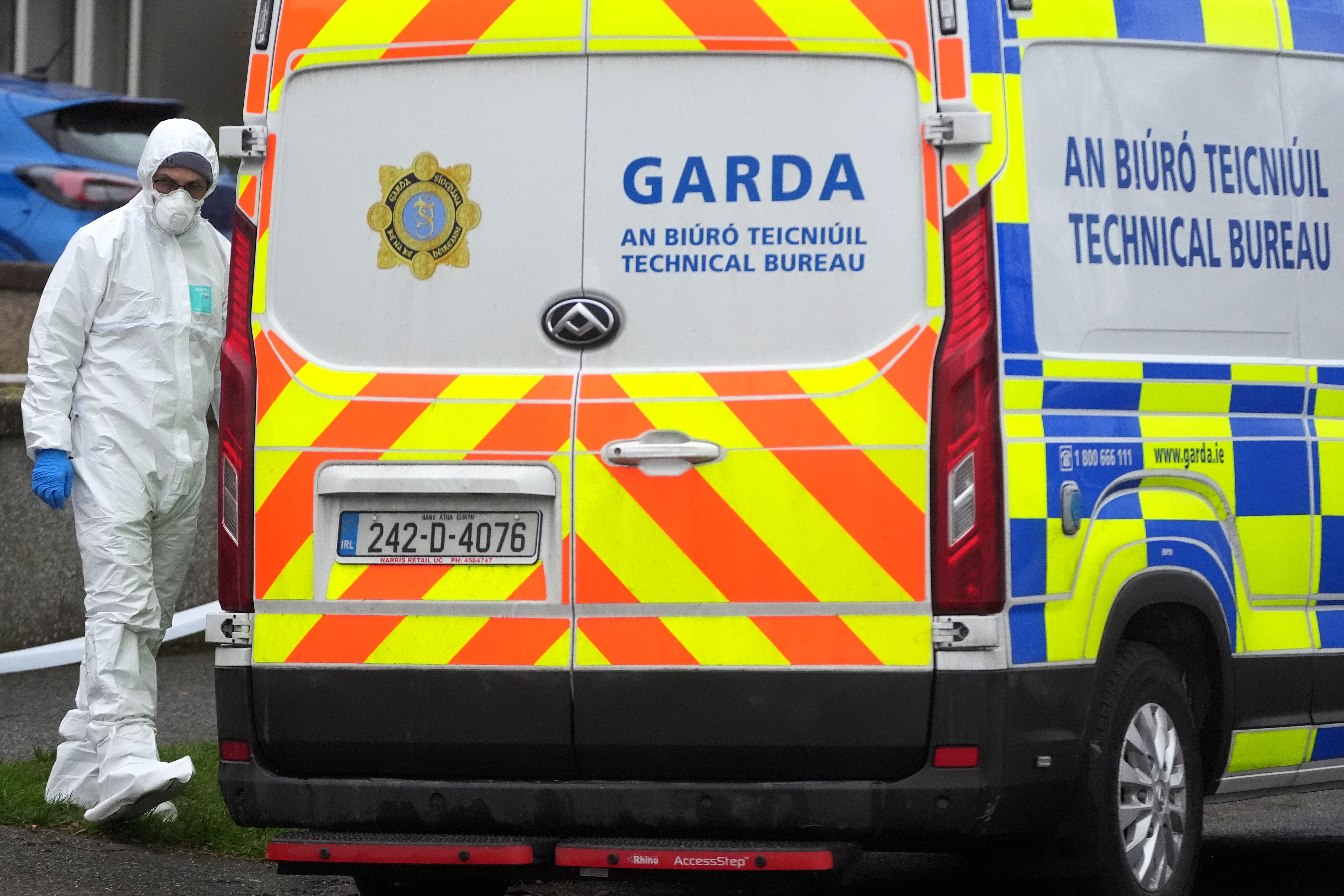 A member of An Garda Technical Bureau outside a property in the Clondalkin area of Dublin (Brian Lawless/PA)