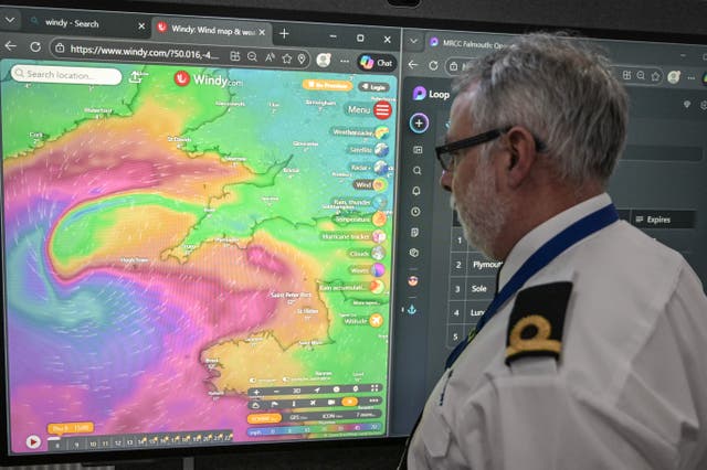 <p>An officer at the Falmouth Maritime Rescue Co-ordination Centre monitors the progress of Storm Goretti </p>