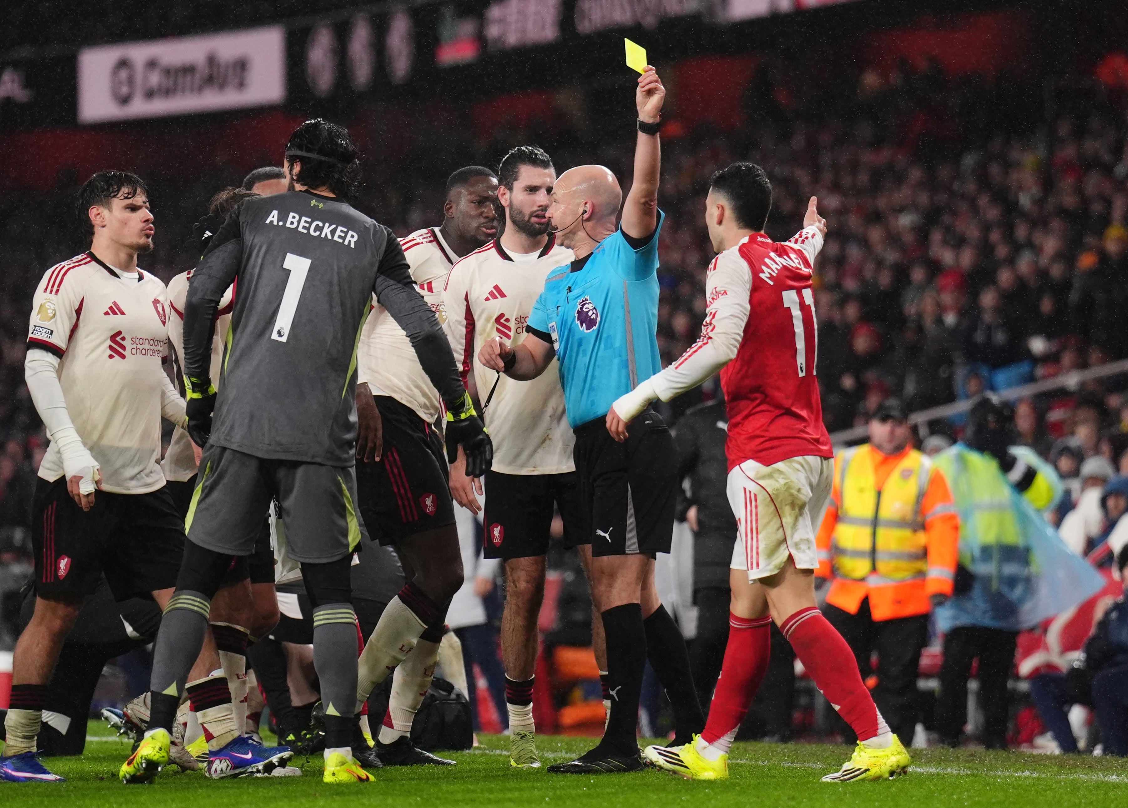 <p>Arsenal’s Gabriel Martinelli (right) was booked for moving injured Liverpool full-back Conor Bradley (not pictured) off the pitch</p>