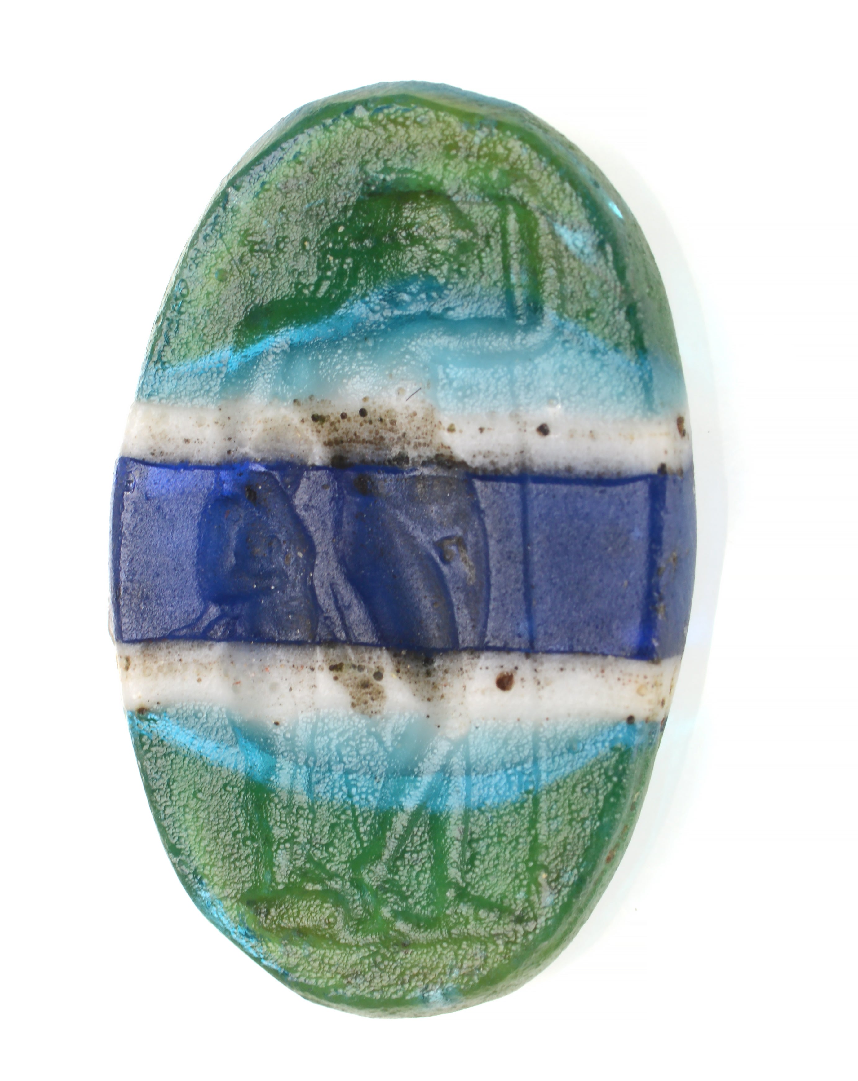 Among the gems recovered is this ancient glass intaglio with Bacchus standing, leaning on Silenus Roman. It is dated to between late 1st century BC and 1st century AD