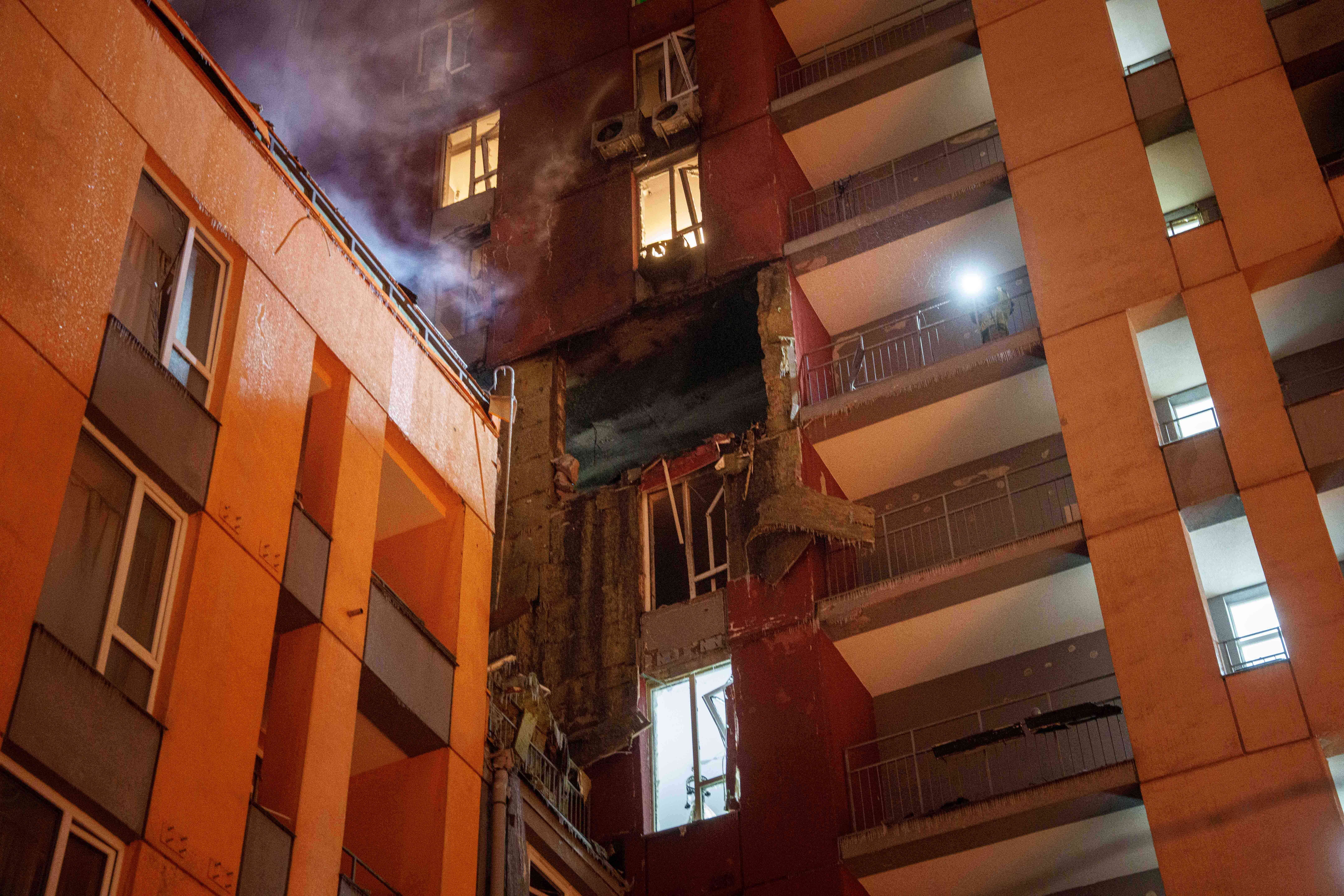 Smoke rises from a residential building damaged by a Russian strike on Kyiv on Friday