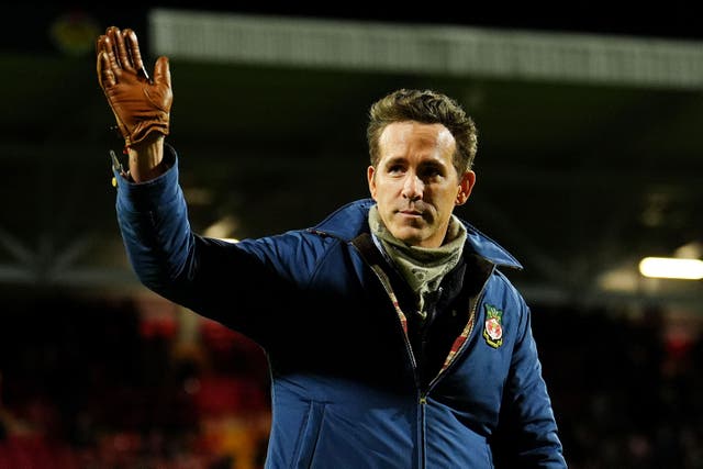 Wrexham co-owner Ryan Reynolds salutes the STok Cae Ras crowd ahead of their FA Cup victory over Nottingham Forest (Martin Rickett/PA)