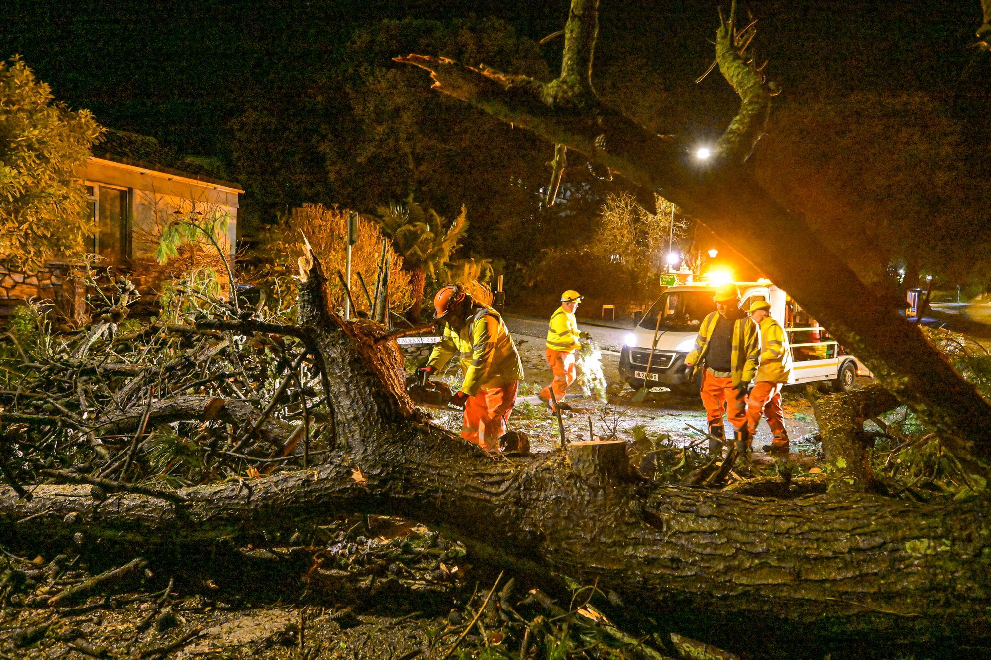 Council workers clear fallen trees from a road after Storm Goretti passed through at night on 8 January 2026 in Falmouth, Cornwall, England