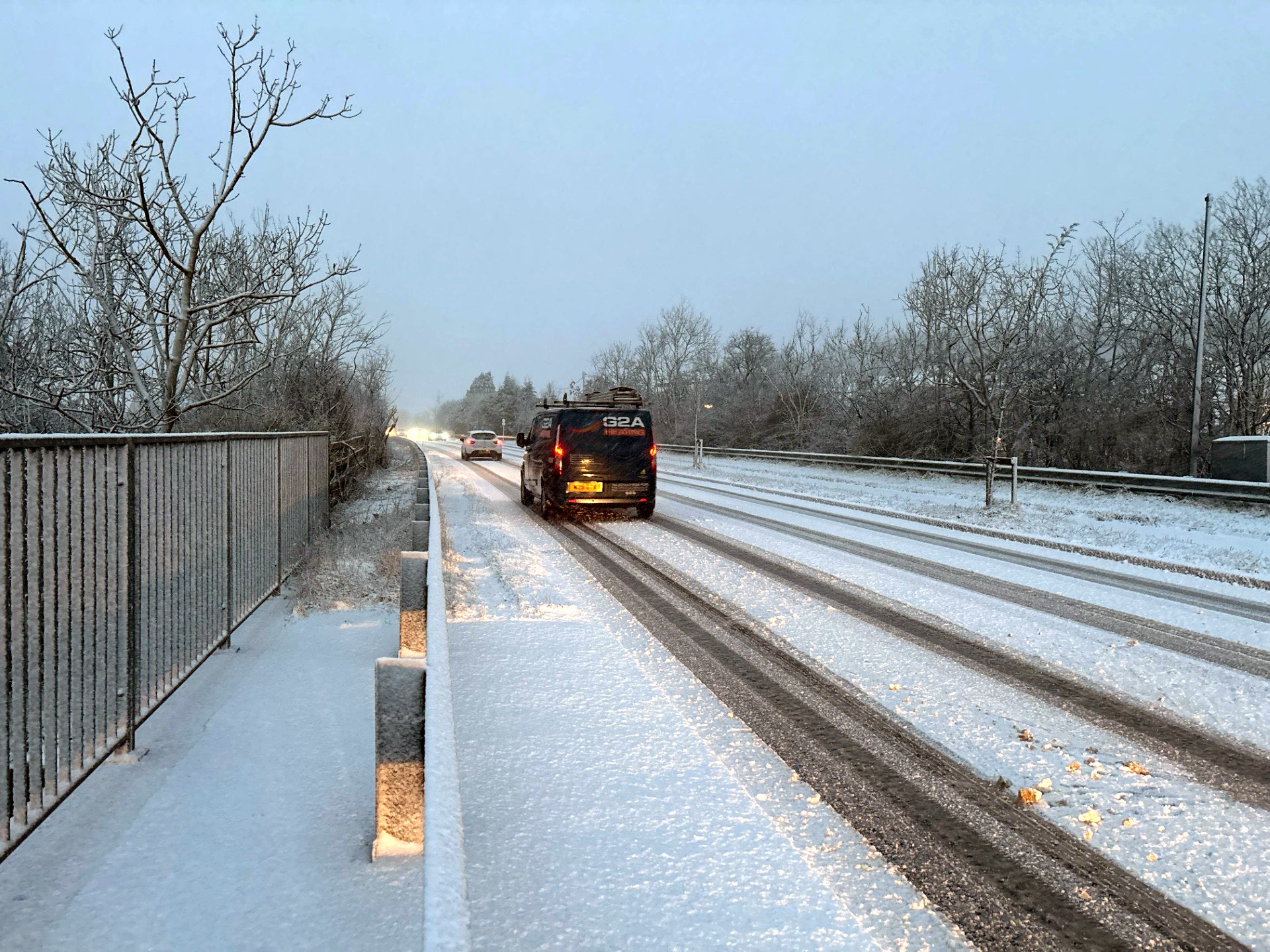 Vehicles drive through snowy conditions in in Rassau, Ebbw Vale in South Wales