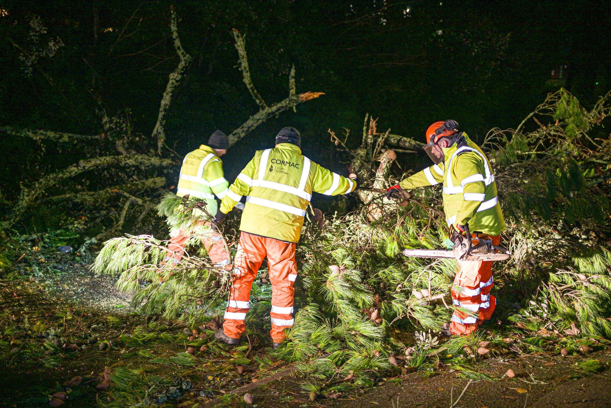 Council workers clear fallen trees from a road after Storm Goretti passed through at night on 8 January 2026 in Falmouth, Cornwall, England