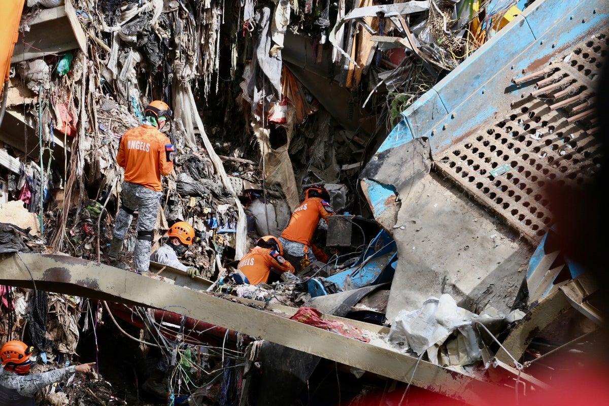 Rescuers in Philippines detect ‘signs of life’ in garbage avalanche that killed four workers
