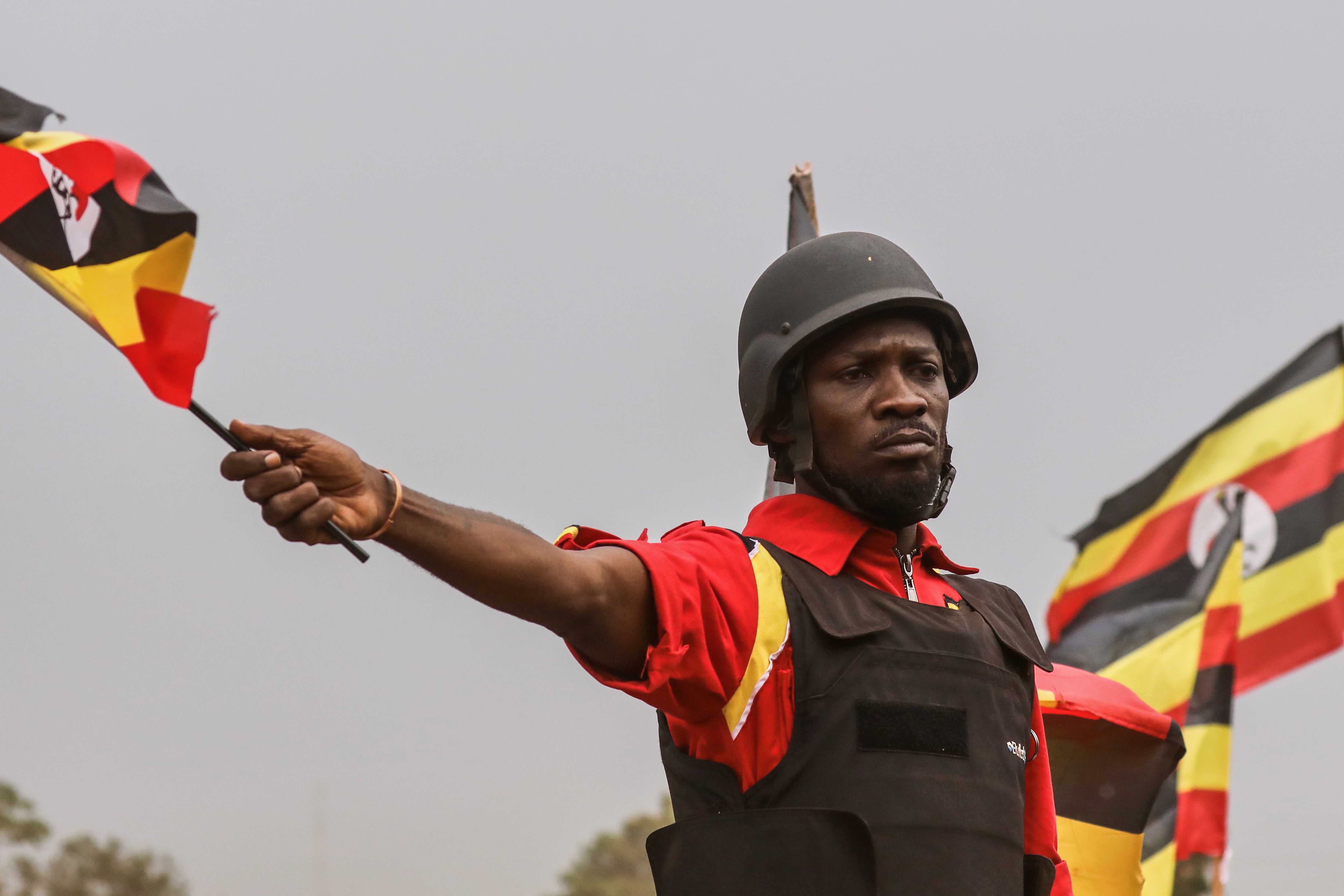 Uganda opposition presidential candidate Robert Kyagulanyi Ssentamu who is known as Bobi Wine waves to supporters at an election campaign rally in Mukono, Uganda earlier this month