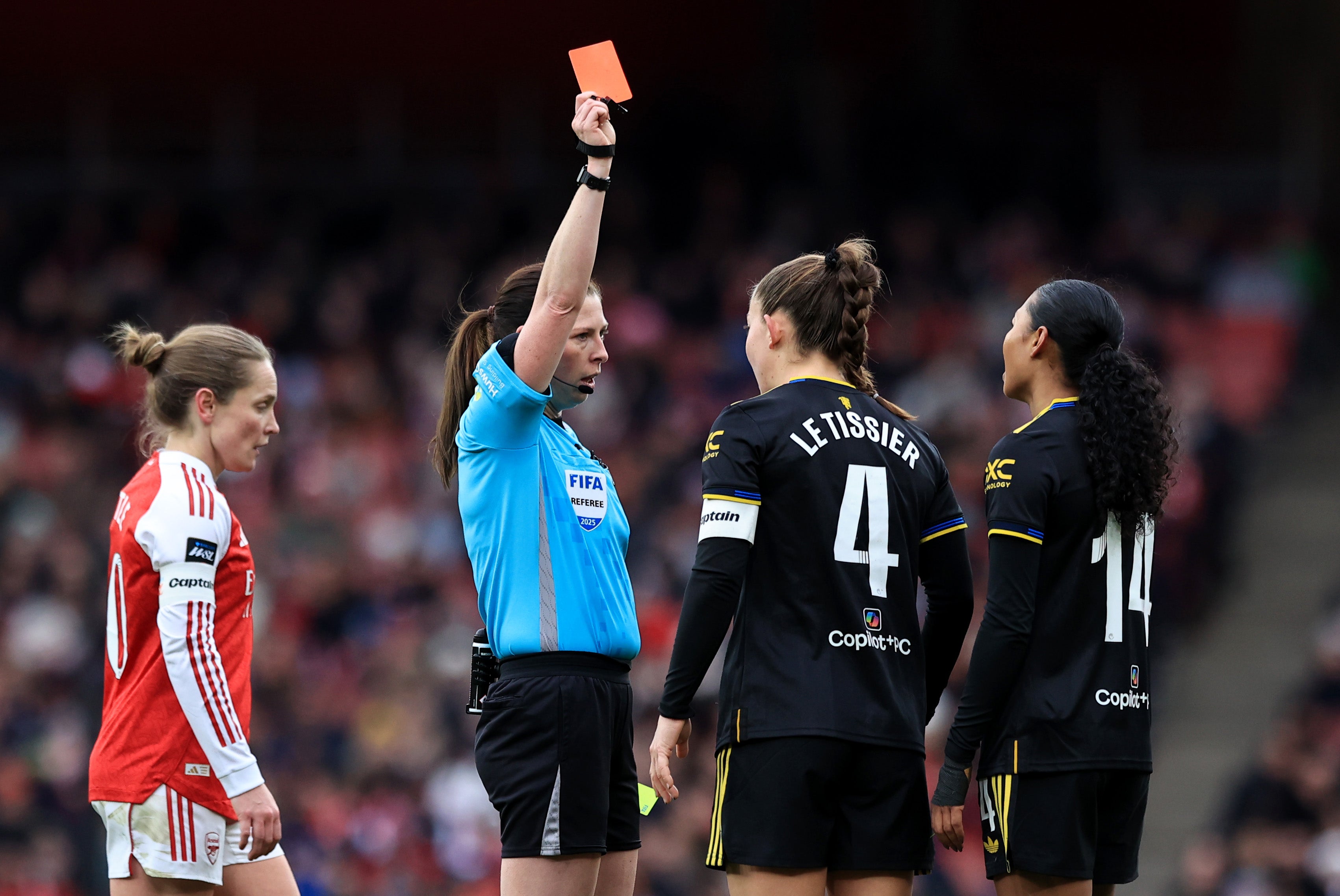 <p> Referee Abigail Byrne shows a red card to Jayde Riviere </p>