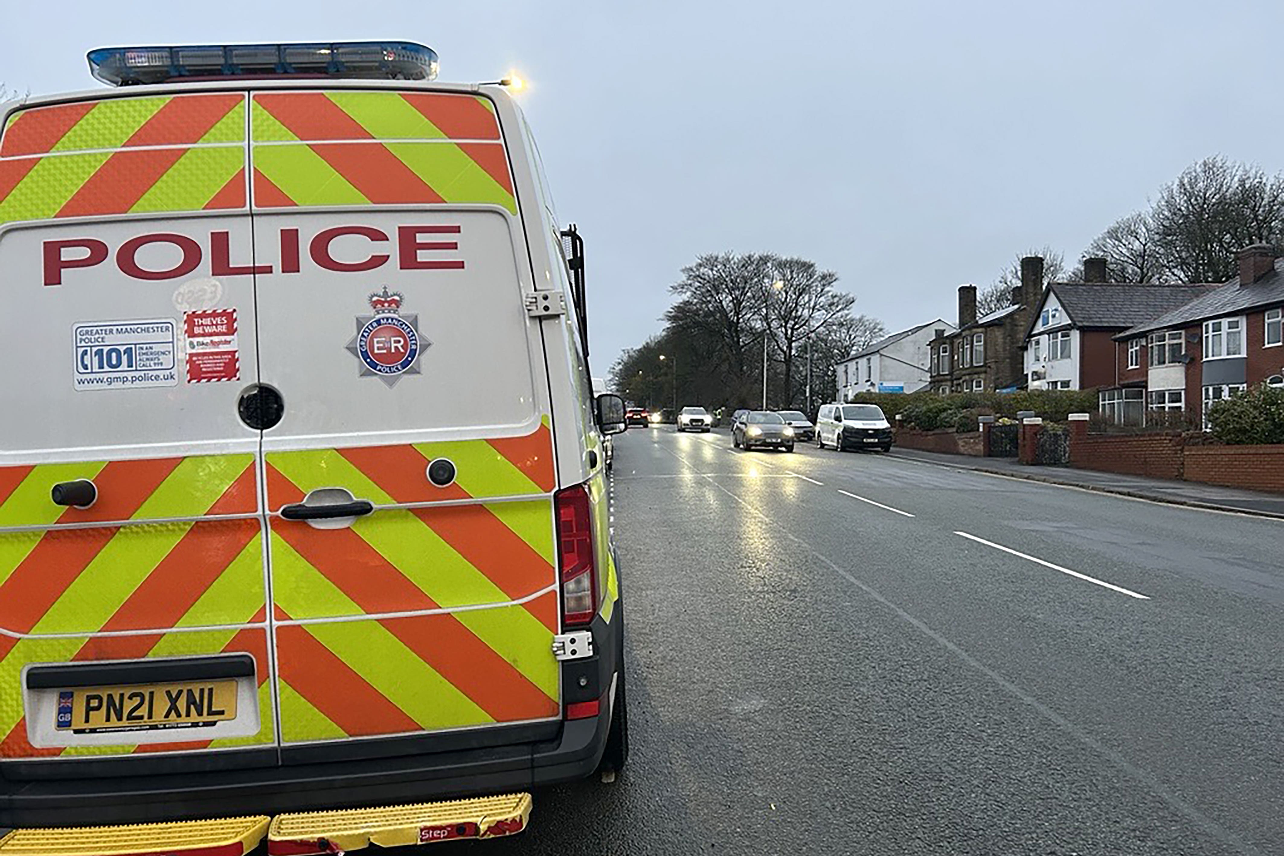 Police near the scene on Wigan Road in Bolton (Madhuri Karia/PA)