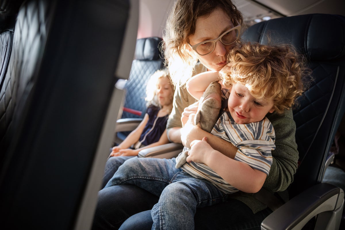 Don’t moan about kids on flights – think about the parents