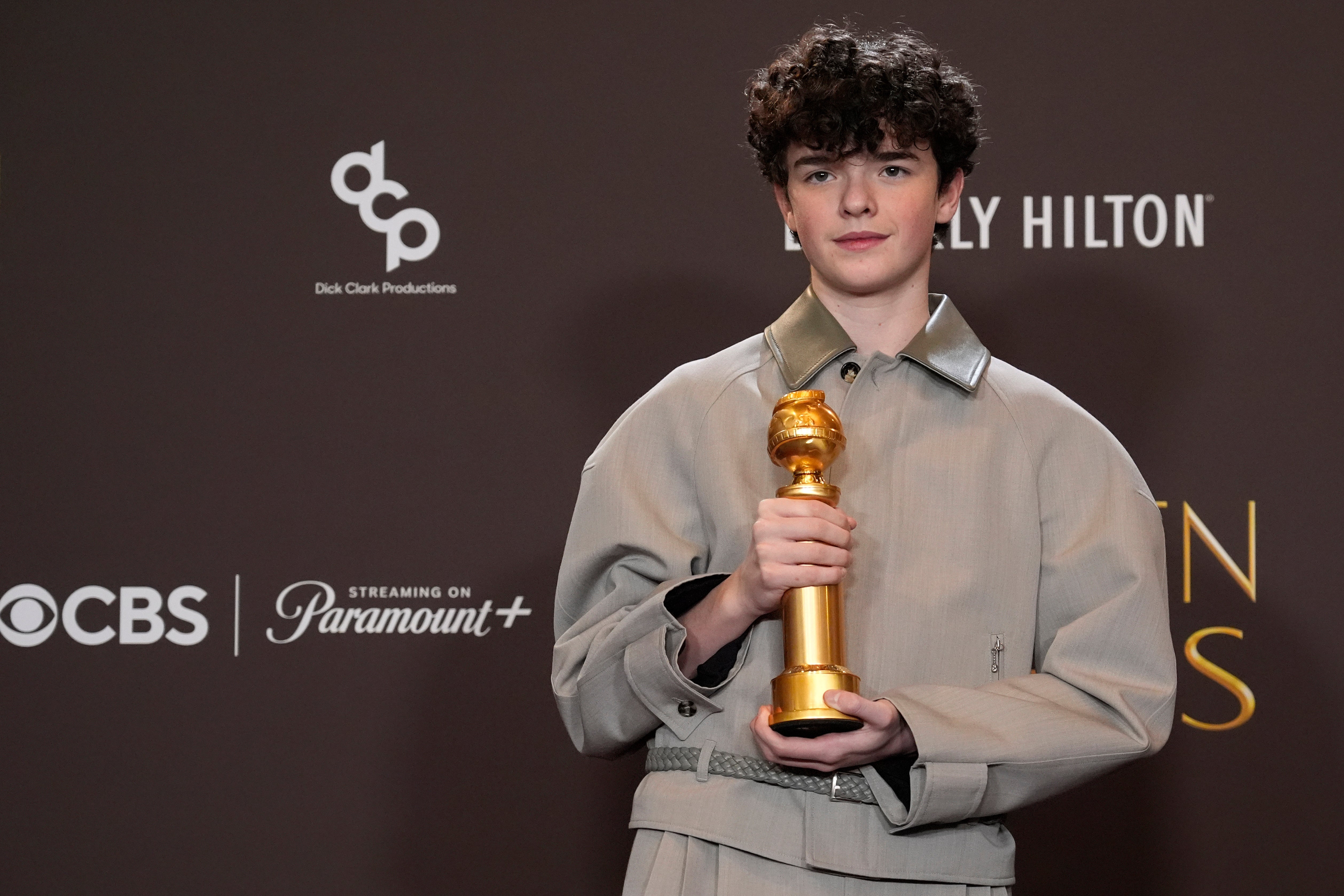 <p>Owen Cooper poses in the press room with the award for best performance by a male supporting actor in a television series (Chris Pizzello/AP)</p>