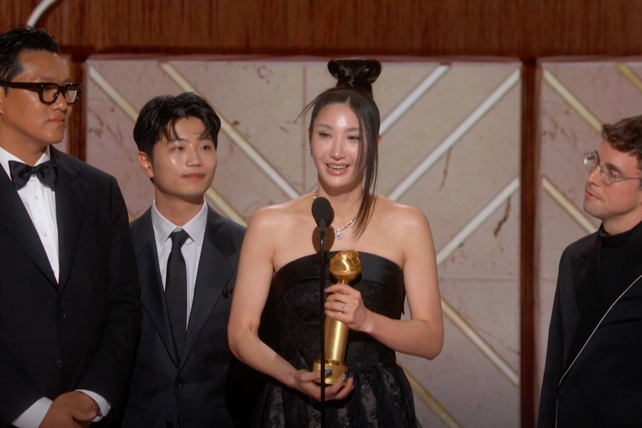 Ejae accepts the Golden Globe for Best Original Song