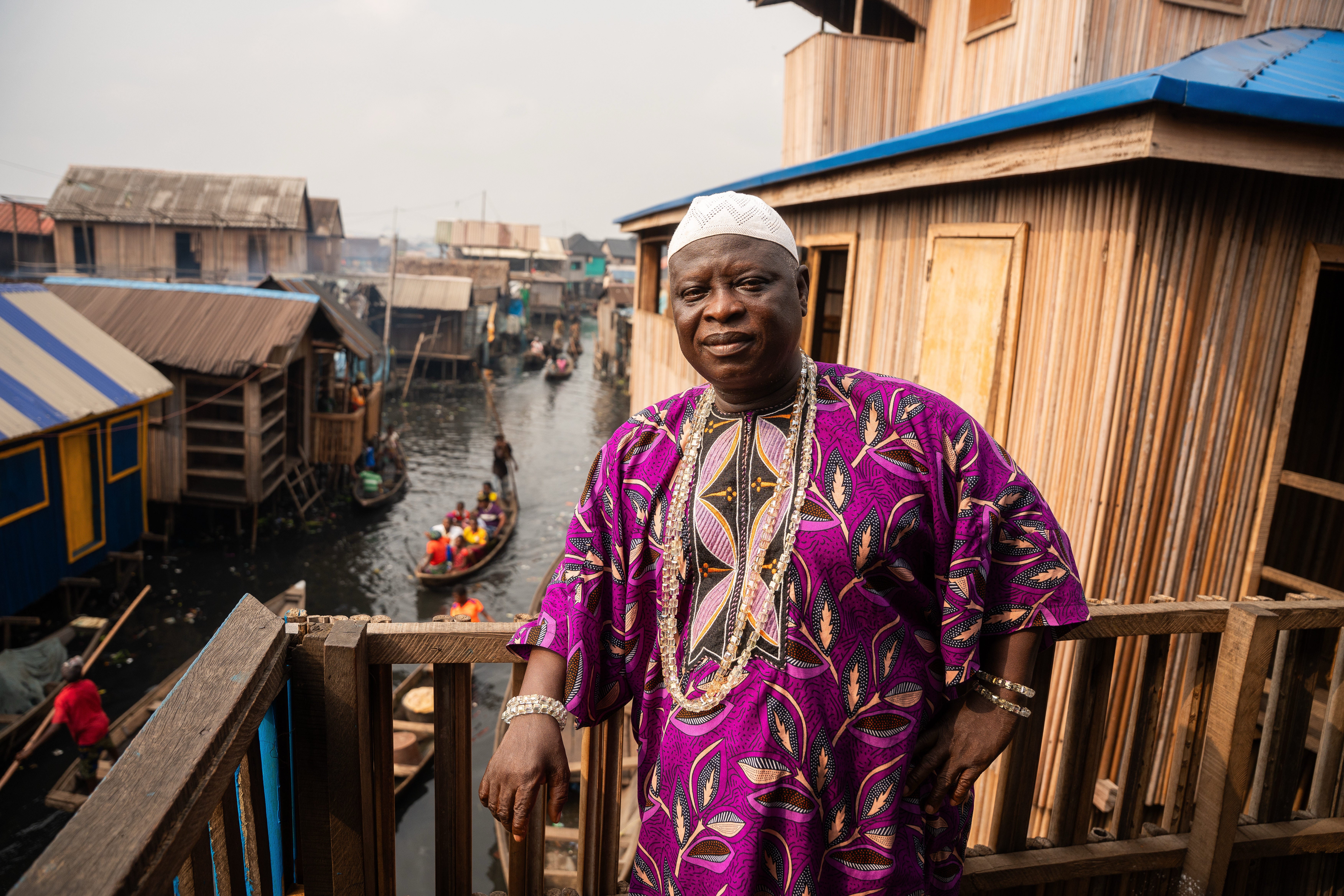 Traditional leader of Makoko, Baale Semede Emmanuel stands outside his home in the coastal community of Makoko, Saturday, Dec. 13, 2025, in Lagos Nigeria. (AP Photo/Grace Ekpu)