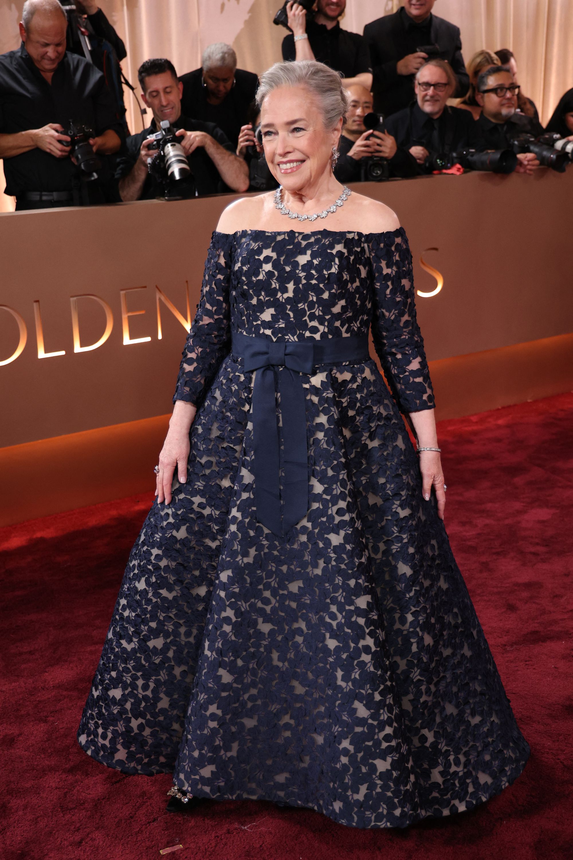 Kathy Bates looked so elegant in a tailored off-the-shoulder gown, but its navy blue lace overlay was too busy