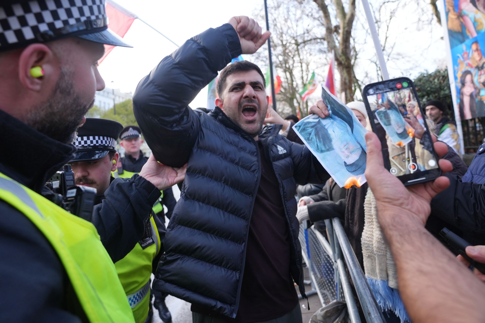 Four police officers injured and 14 arrested after &lsquo;violent&rsquo; clashes outside Iran&rsquo;s London embassy