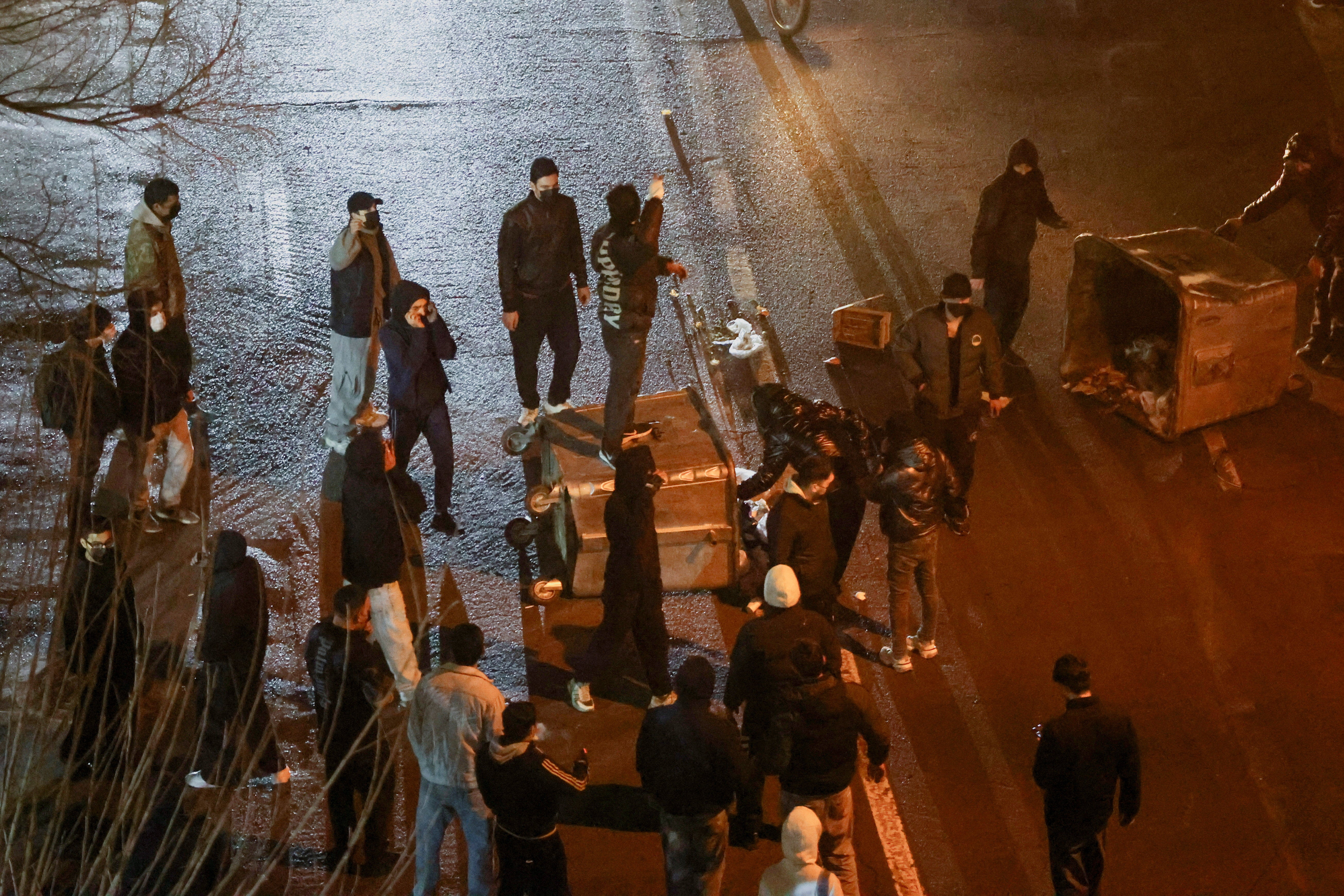 Iranian demonstrators gather in a street during a protest over the collapse of the currency's value, in Tehran, Iran, January 8