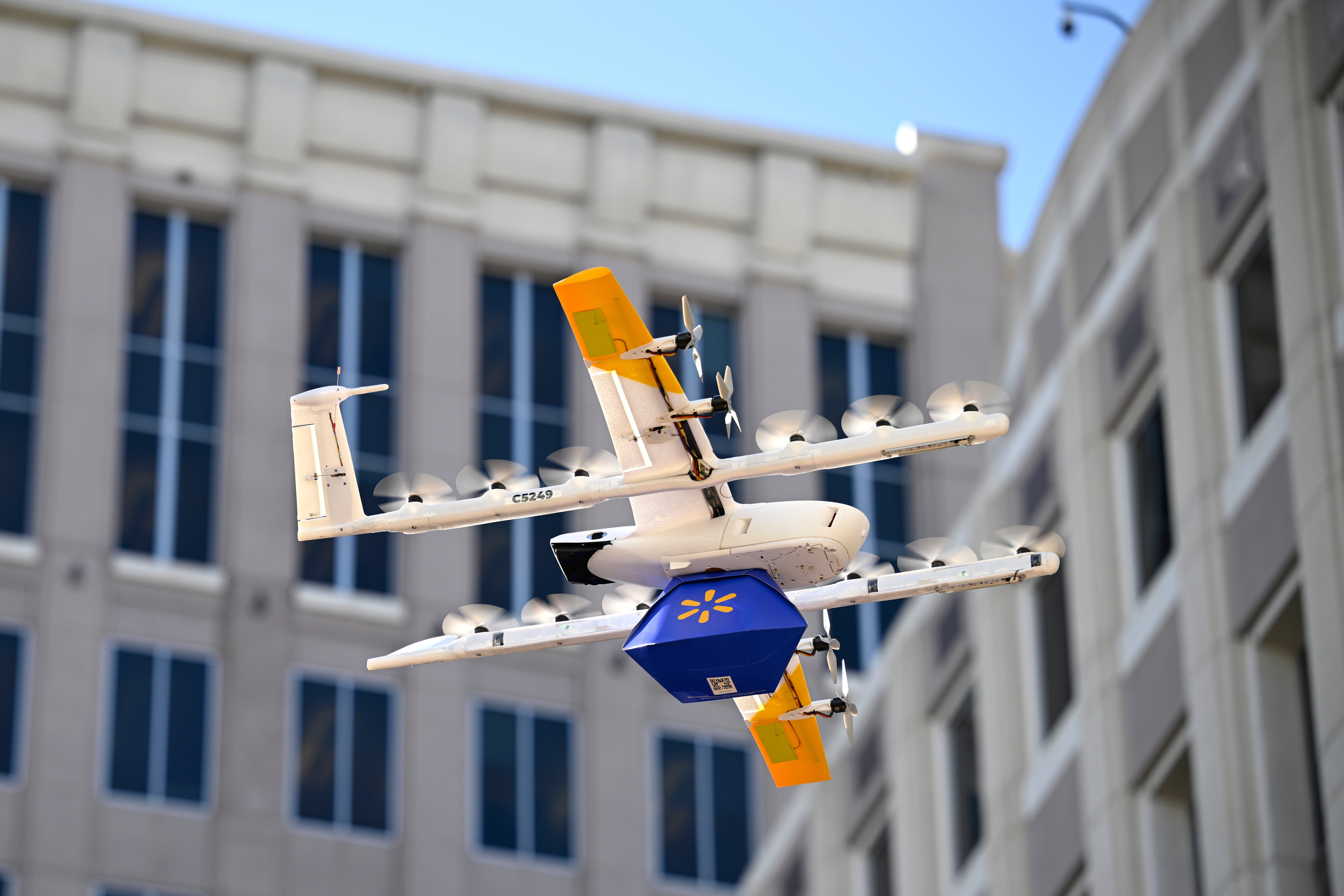 <p>A Walmart-branded Wing drone brings items to Orlando City Hall on Tuesday Dec. 16, 2025 to mark the retail giant's expansion of aerial shipments to the Florida city</p>