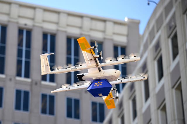 <p>A Walmart-branded Wing drone brings items to Orlando City Hall on Tuesday Dec. 16, 2025 to mark the retail giant's expansion of aerial shipments to the Florida city</p>