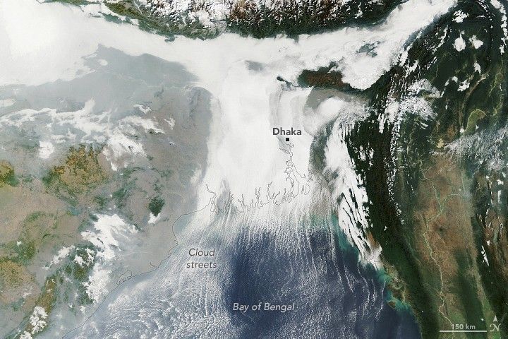 Low clouds blanketed the delta while parallel cloud bands rolled over the Bay of Bengal during a January cold wave.