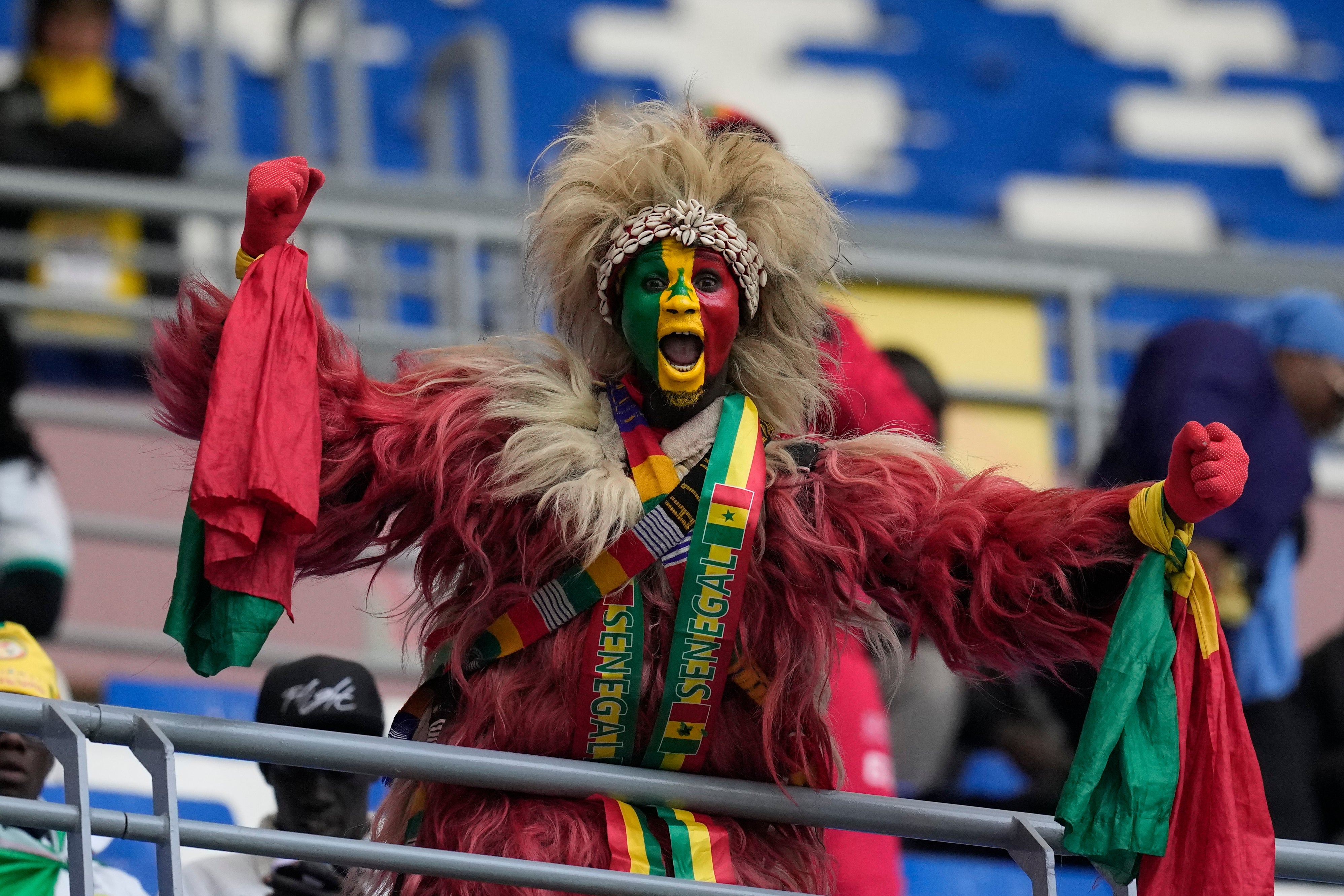 A Senegal fan cheers for his national team ahead of the start of the Africa Cup of Nations quarterfinal soccer match between Senegal and Mali in Tangier, Morocco, Friday, Jan. 9, 2026. (AP Photo/Themba Hadebe)