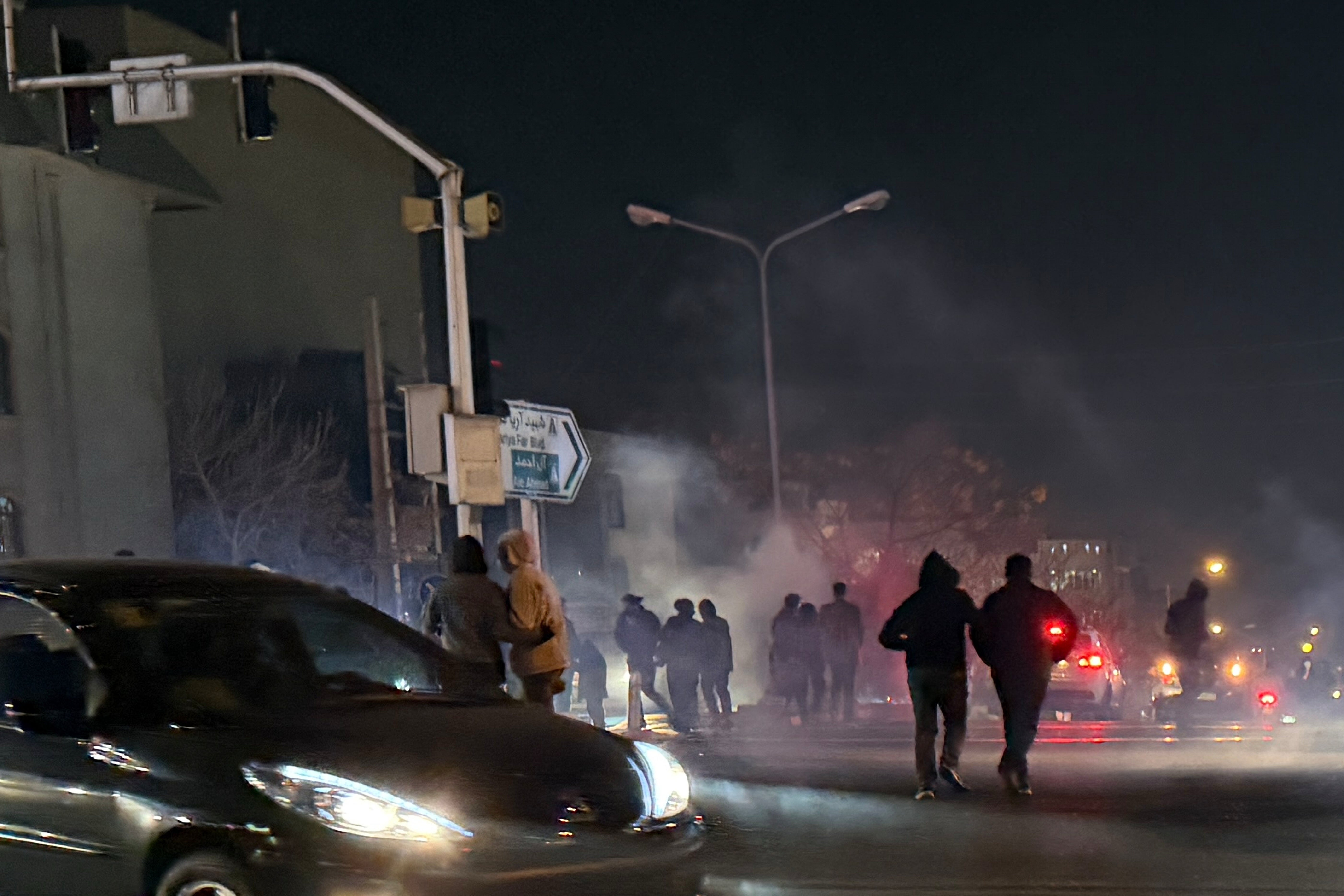 Tear gas being fired during an anti-government protest in Tehran, Iran (AP)
