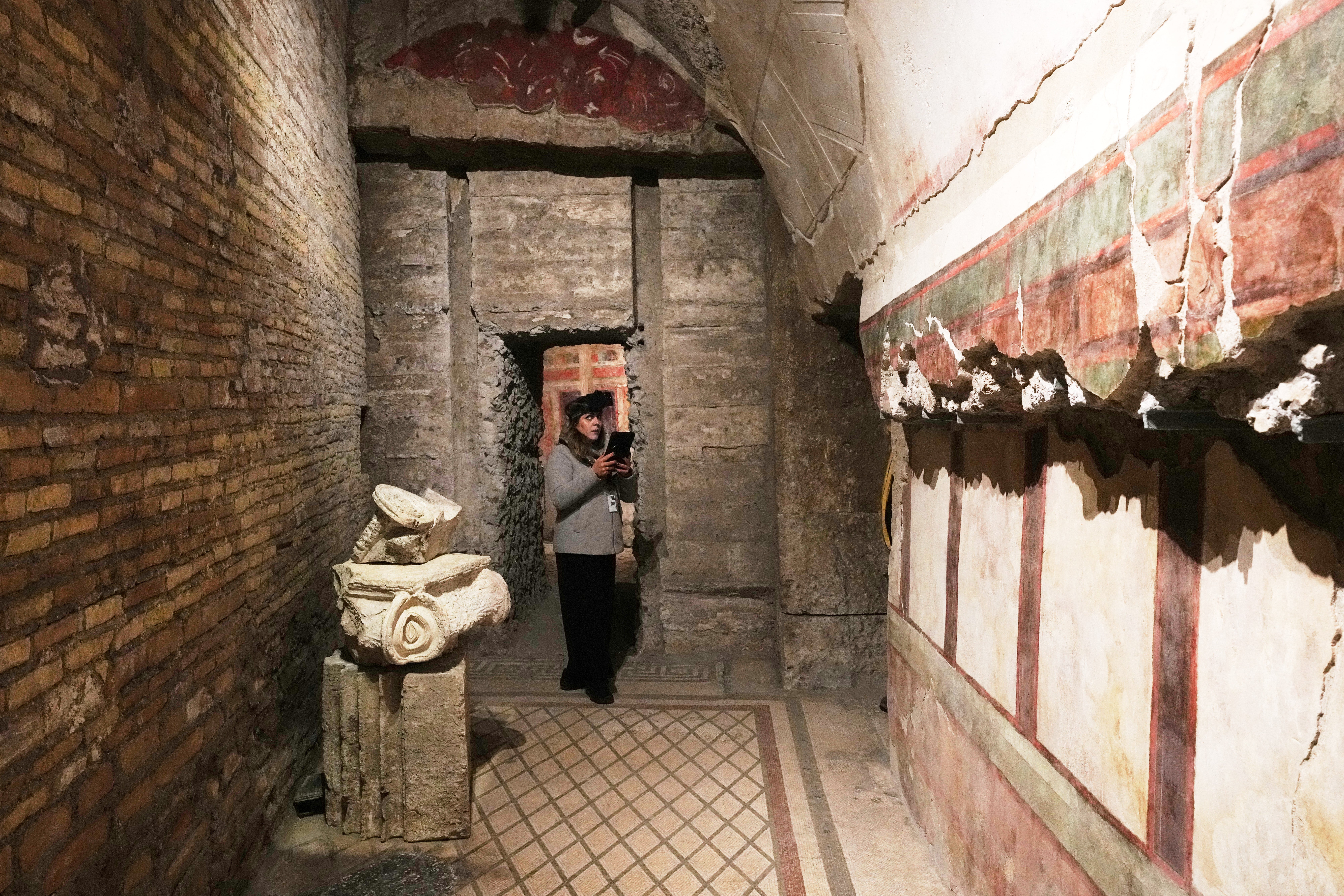 <p>Colosseum Archeological Park guide Valentina uses a head-mounted device to livestream a guided tour for the press of the newly-restored underground House of Griffins next to the Colosseum, in Rome</p>