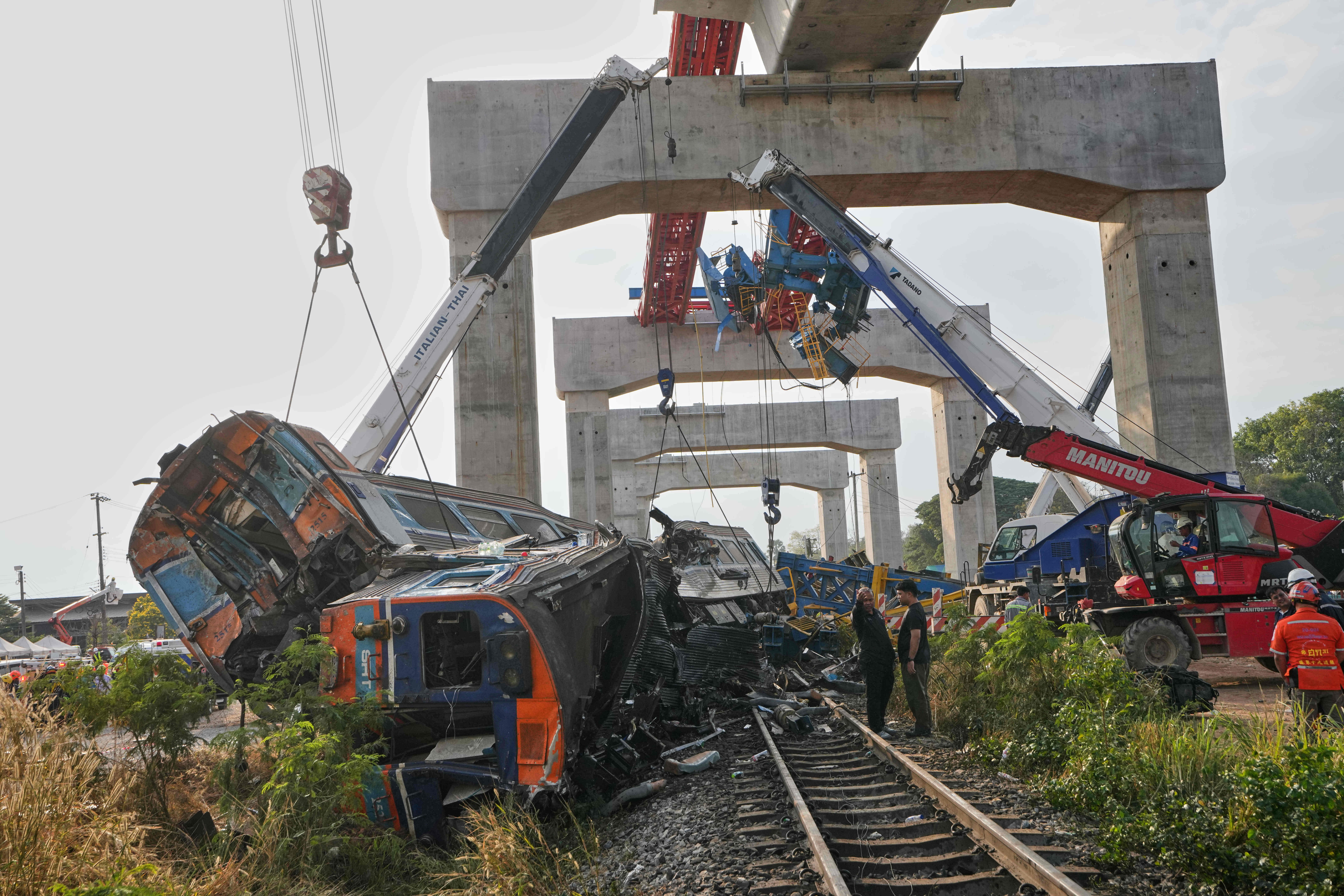 The wreckage after a construction crane fell into a passenger train in Nakhon Ratchasima province, Thailand.