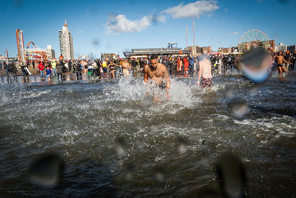 The Polar Plunge at Coney Island, New York on January 1, 2026. Dive into financial education to improve your finances this year, experts advise