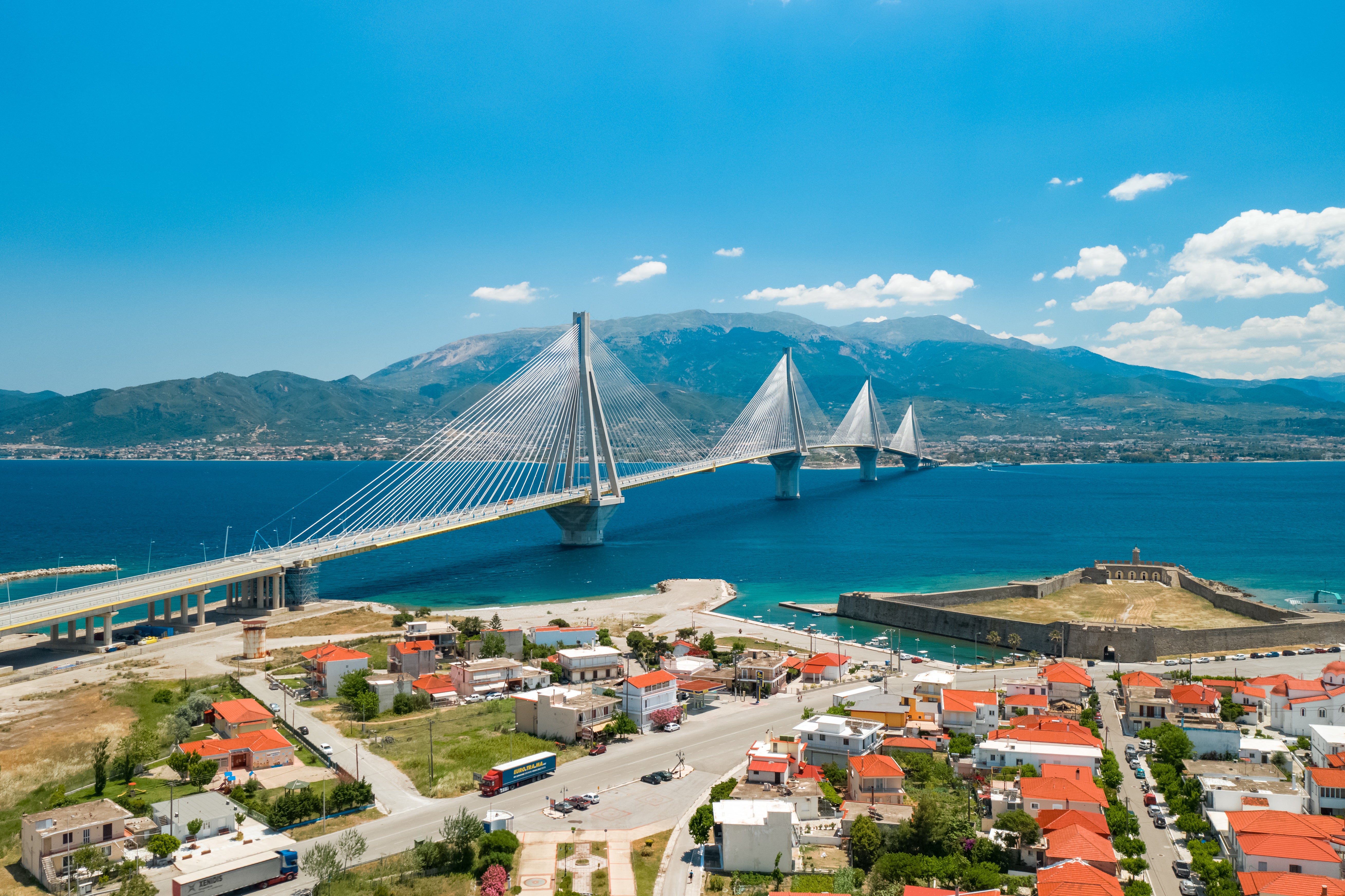 Ferries arriving in Patras, Greece, pass under the epic Rio–Antirrio Bridge