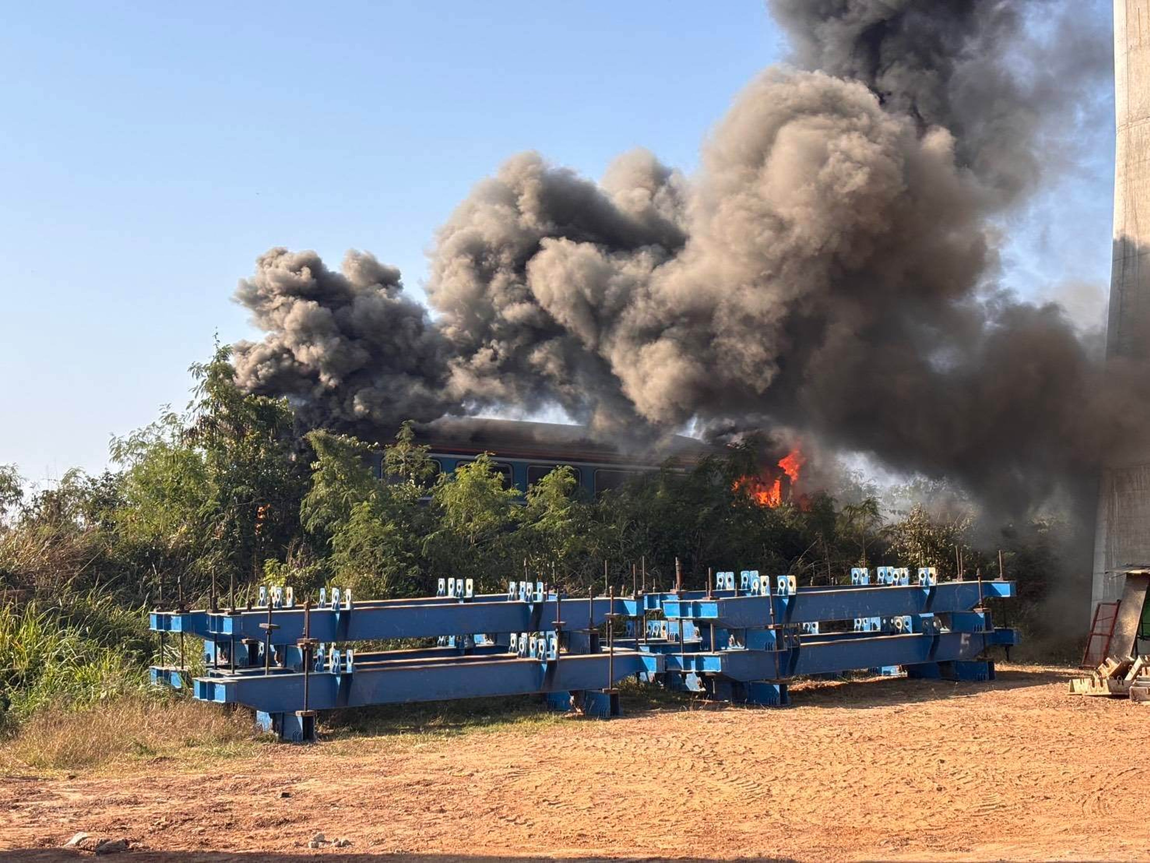 Pictures released by Thailand's Ministry of Transport show smake billowing from the train which caught fire