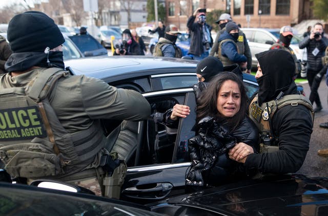 <p>An unidentified woman appeals for help after being dragged from her car by federal agents in Minneapolis on Tuesday January 13, 2026</p>