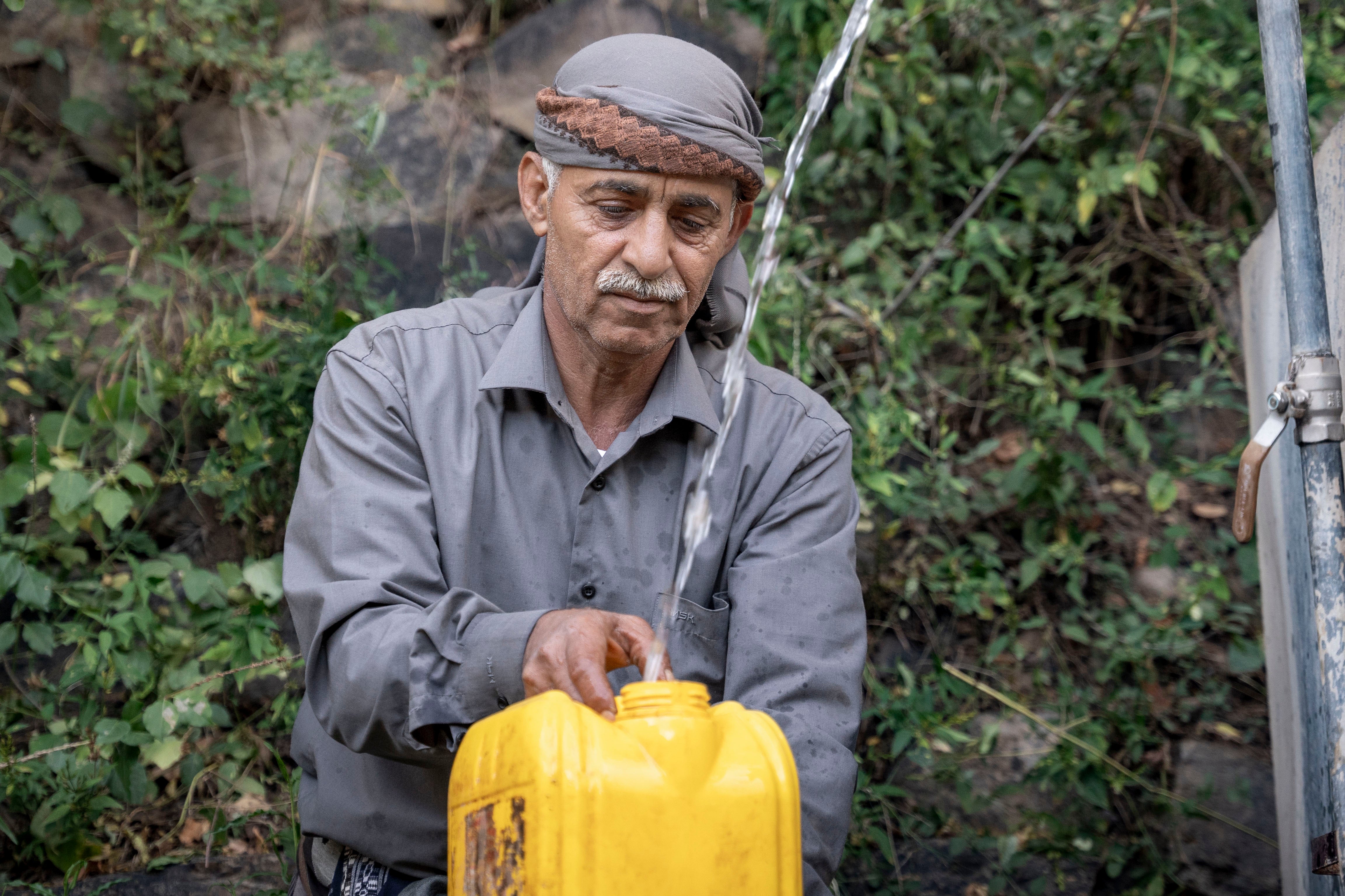 The well and reservoir in Jameel’s village has recently been rehabilitated with concrete, helping farmers with their water supplies