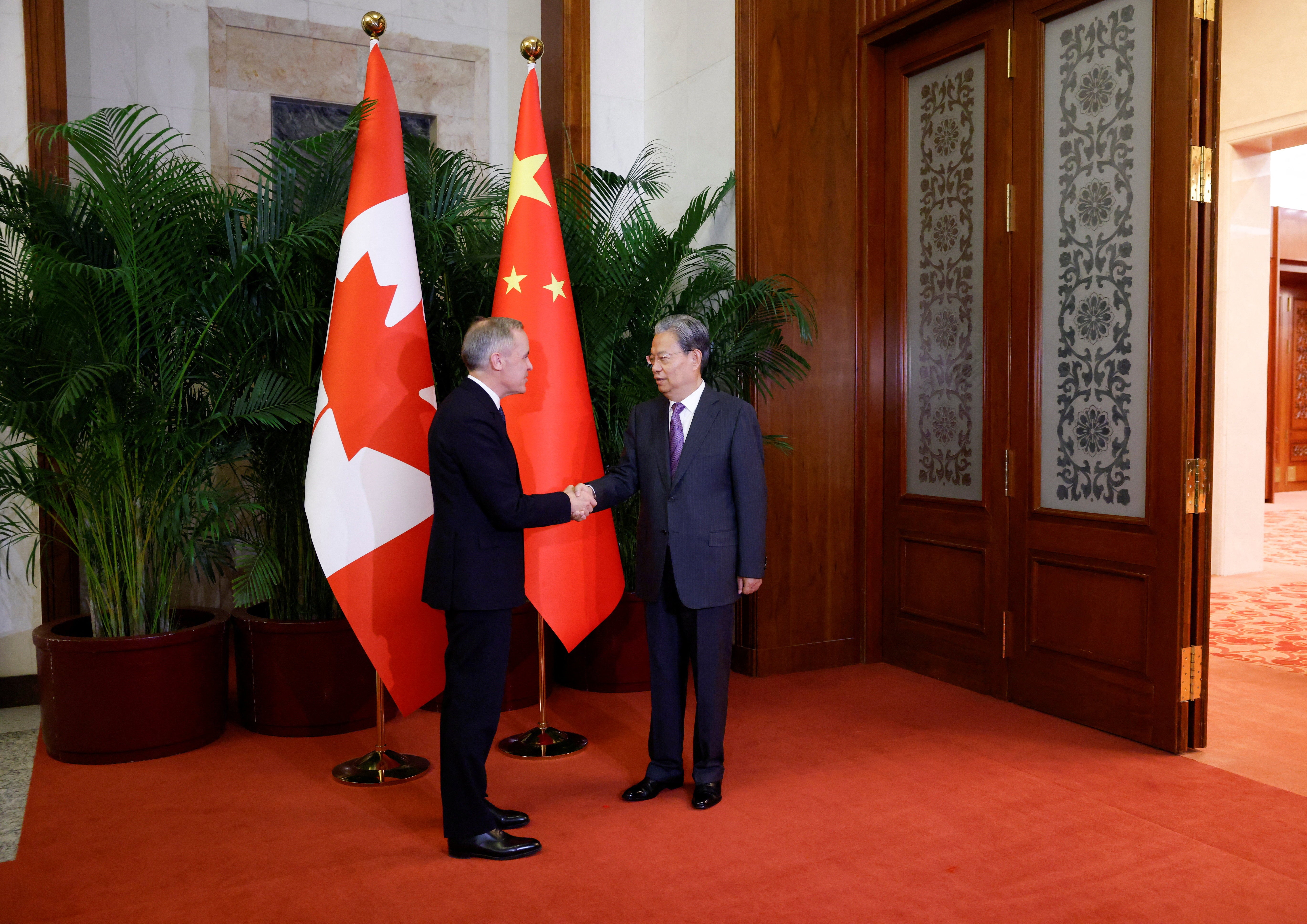 Canada's Prime Minister Mark Carney meets the Chairman of the Standing Committee of the National People's Congress of China Zhao Leji, during the first visit by a Canadian Prime Minister to China since 2017 at the Great Hall of the People, in Beijing, China, January 15, 2026. REUTERS/Carlos Osorio