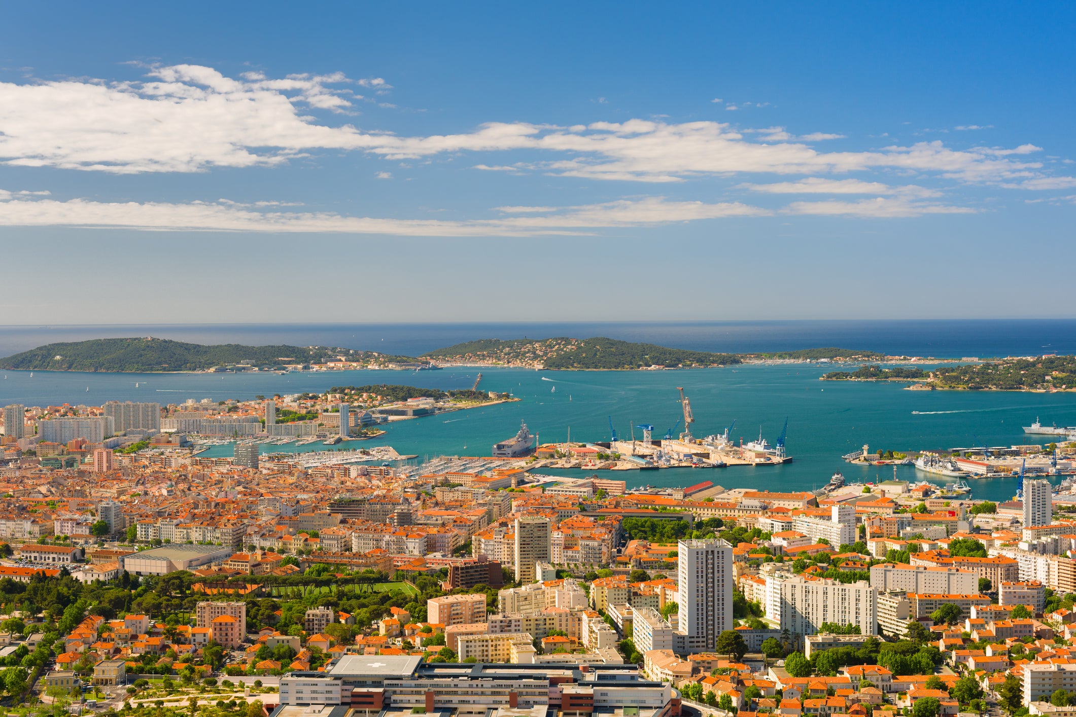 Setting sail from Toulon, pictured, for Mallorca is unforgettable. The ferry departs with French naval ships in the background
