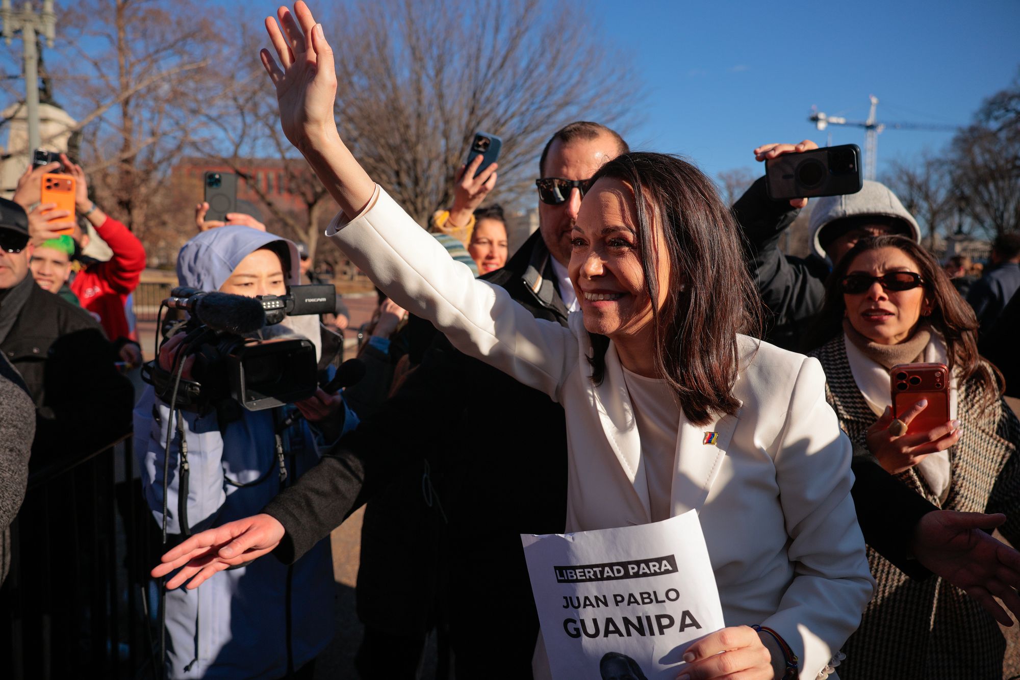 Machado waves to supporters outside the White House
