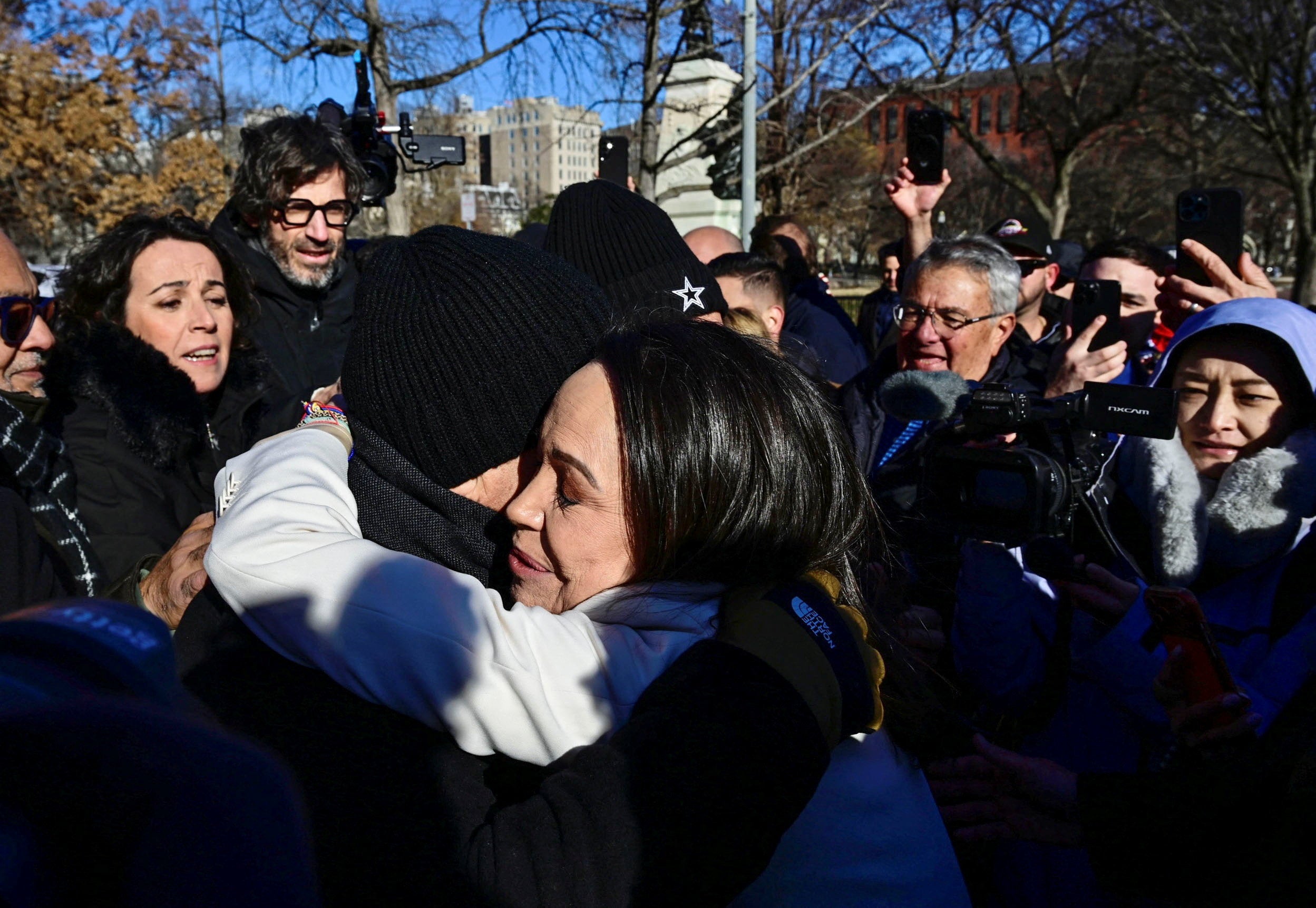 Venezuelan opposition leader Maria Corina Machado is hugged by supporters
