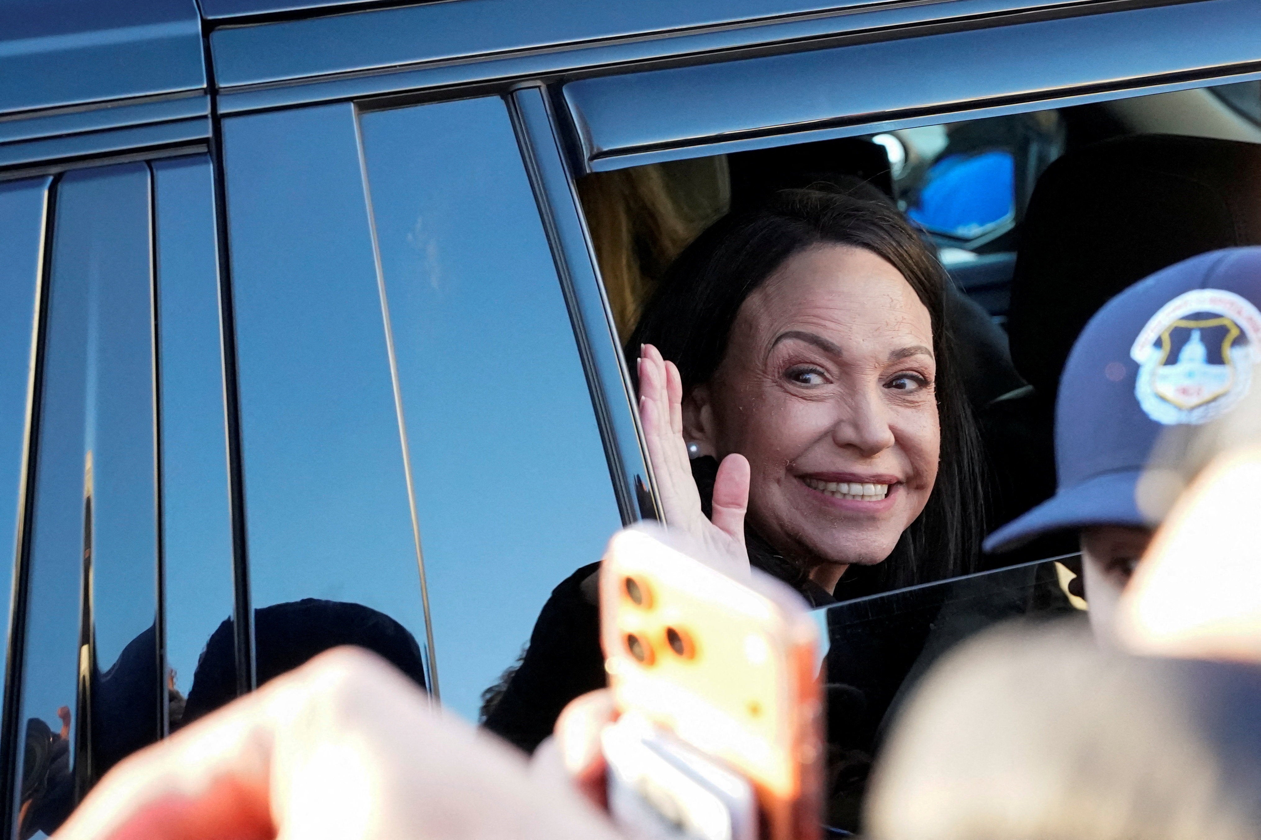 Venezuelan opposition leader Maria Corina Machado waves from a vehicle as she leaves the U.S. Capitol after a meeting with U.S. senators, following an earlier meeting with U.S. President Donald Trump at the White House, in Washington, D.C., U.S., January 15, 2026