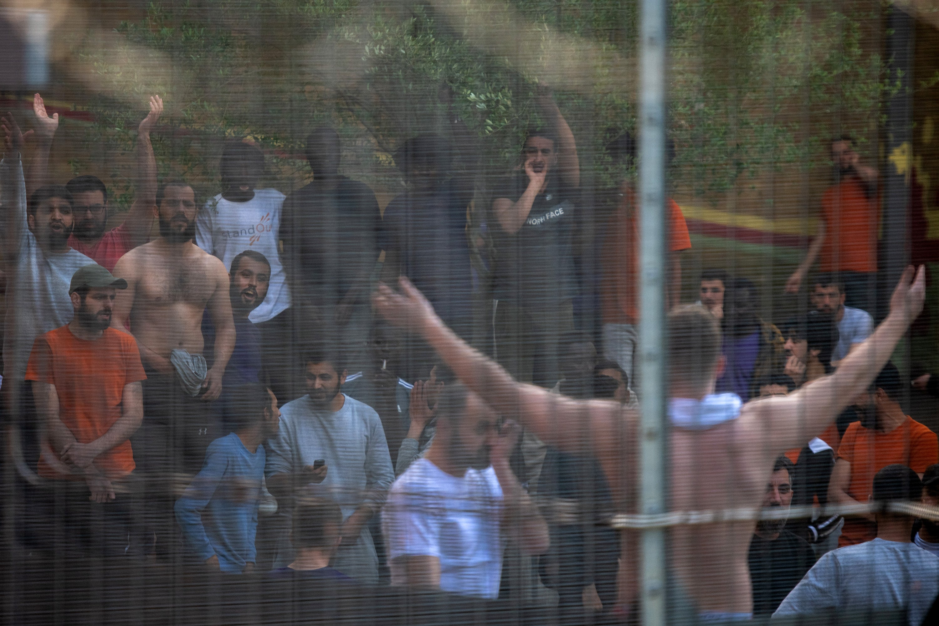 Detainees at Brook House shout and chant in unison with protesters outside the centre against the UK deportation flights to Rwanda in 2022