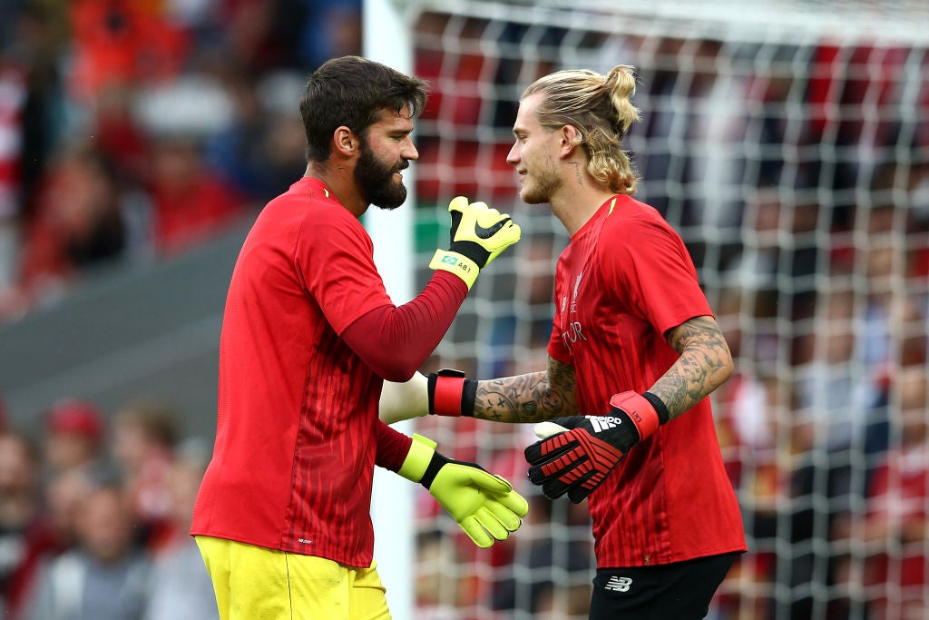 Karius (right) was not told that Liverpool intended to replace him with Alisson Becker (left)