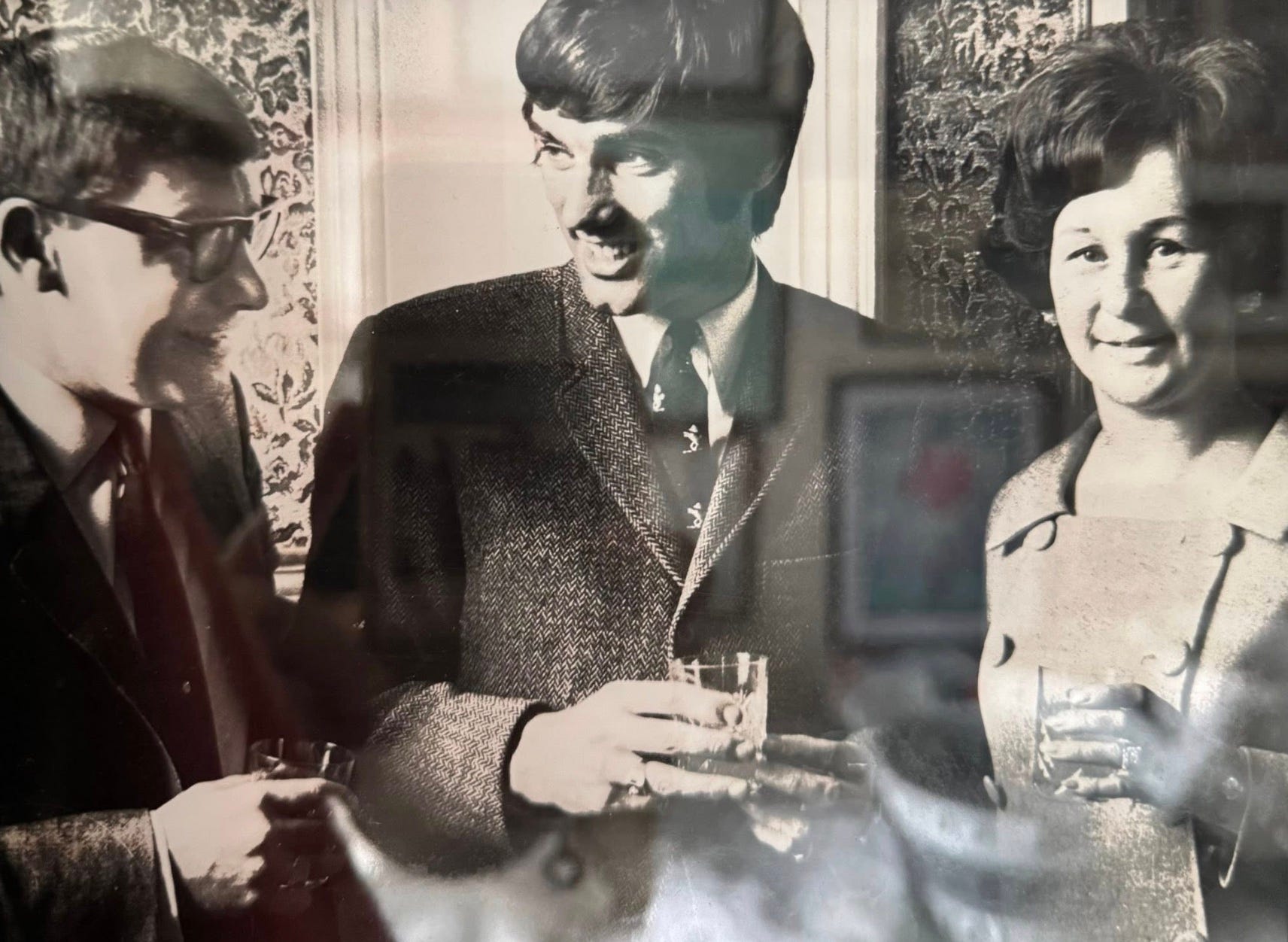 <p>John Roberts and his wife Phyllis  with George Best at the Belfast Town Hall in 1968</p>