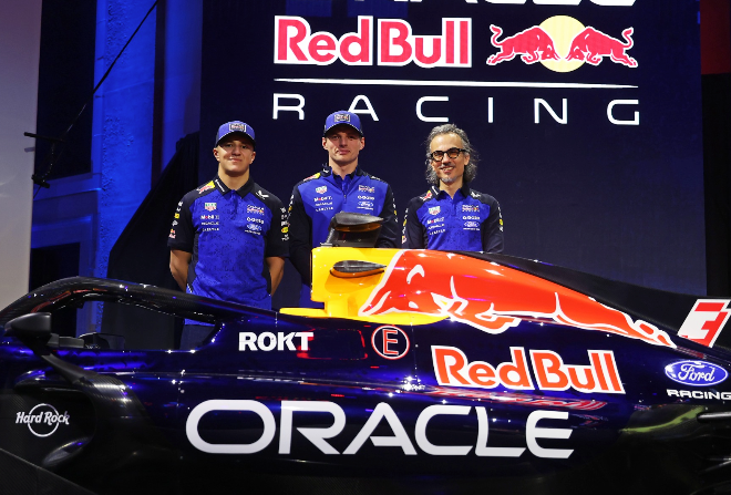 Max Verstappen (centre) poses next to Red Bull's 2026 F1 livery in Detroit on Thursday